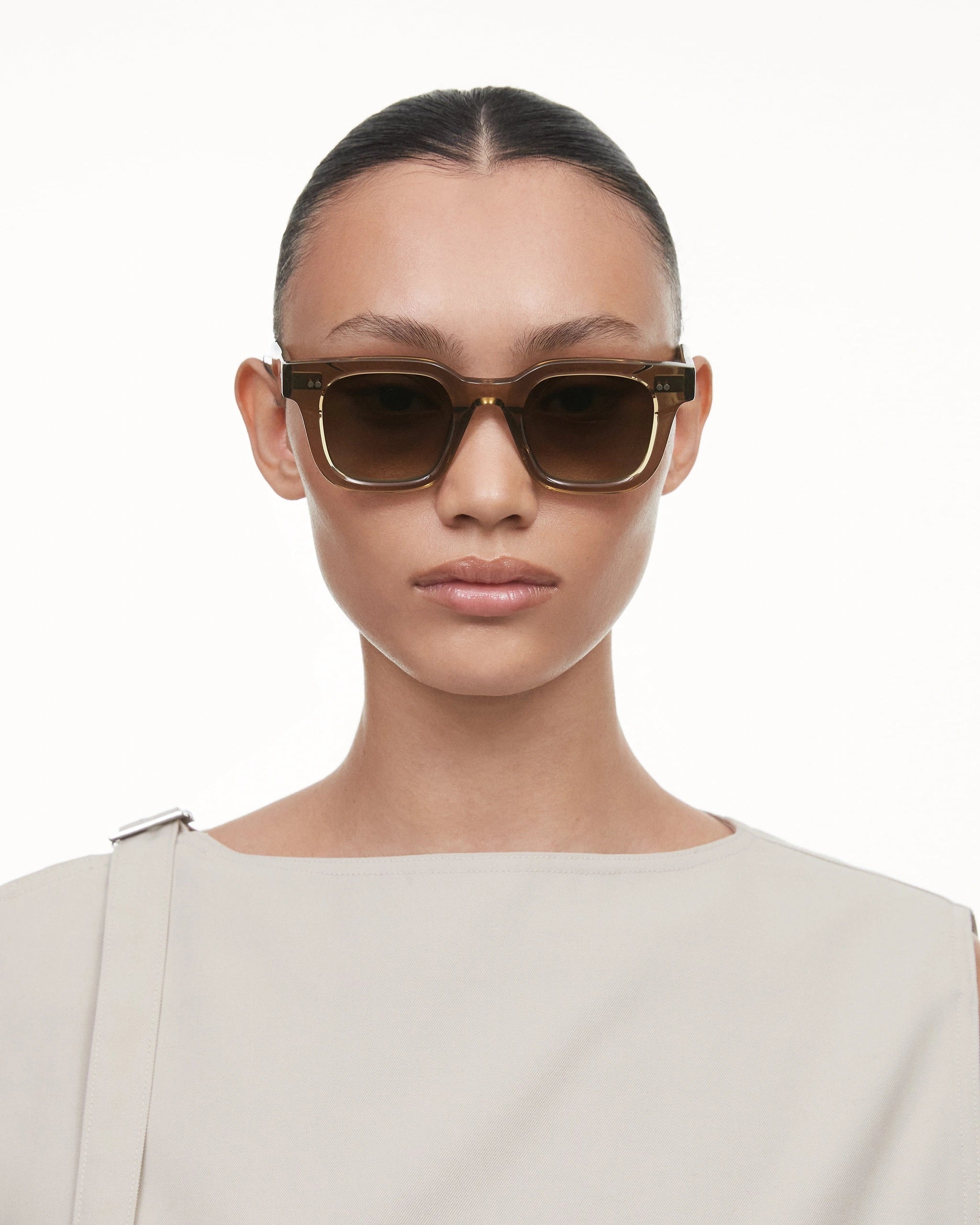 04 Core Green Sunglasses worn by a model, showcasing stylish design and UV protection.