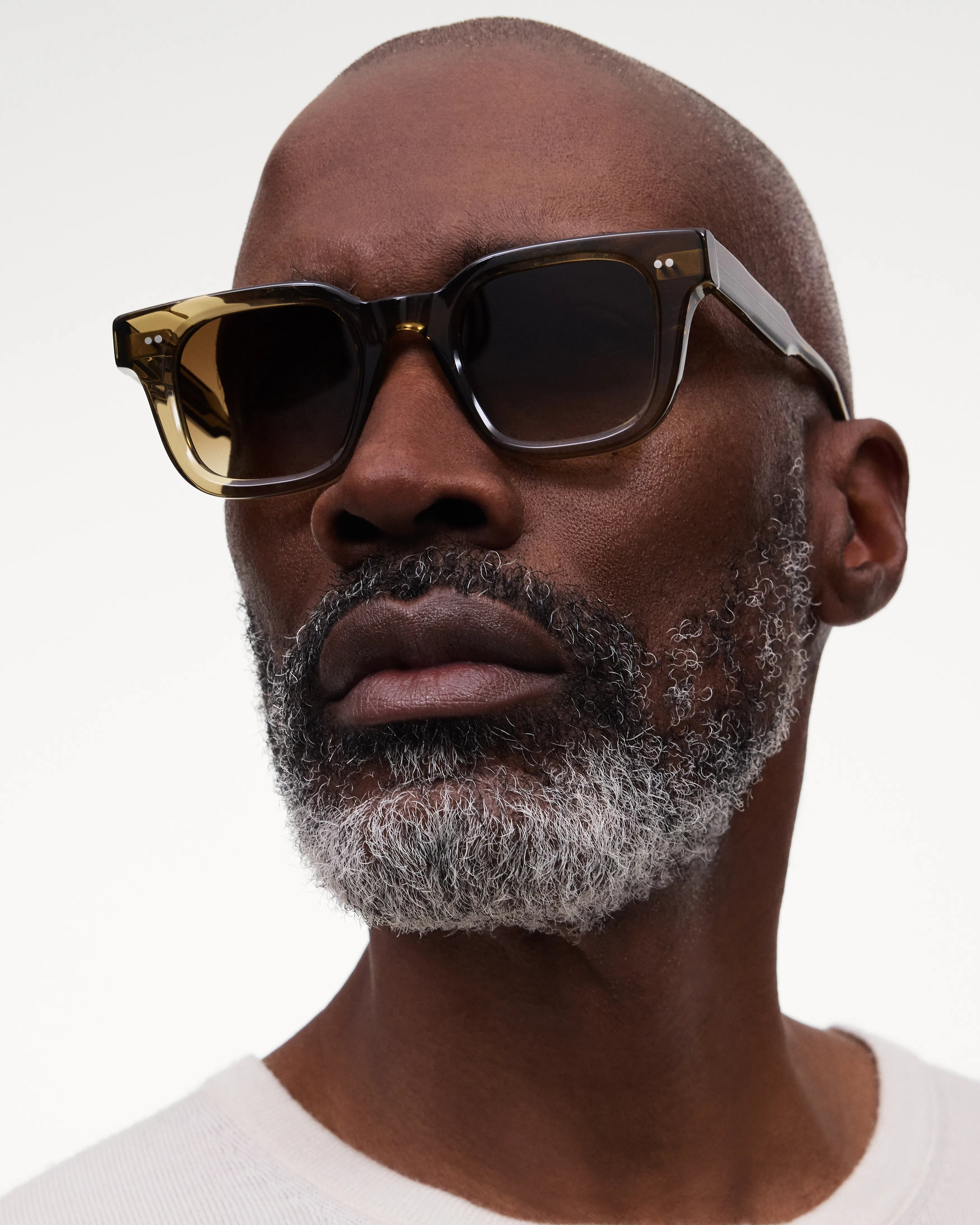 04 Core Green Sunglasses on a model with a beard, showcasing stylish design and UV protection.