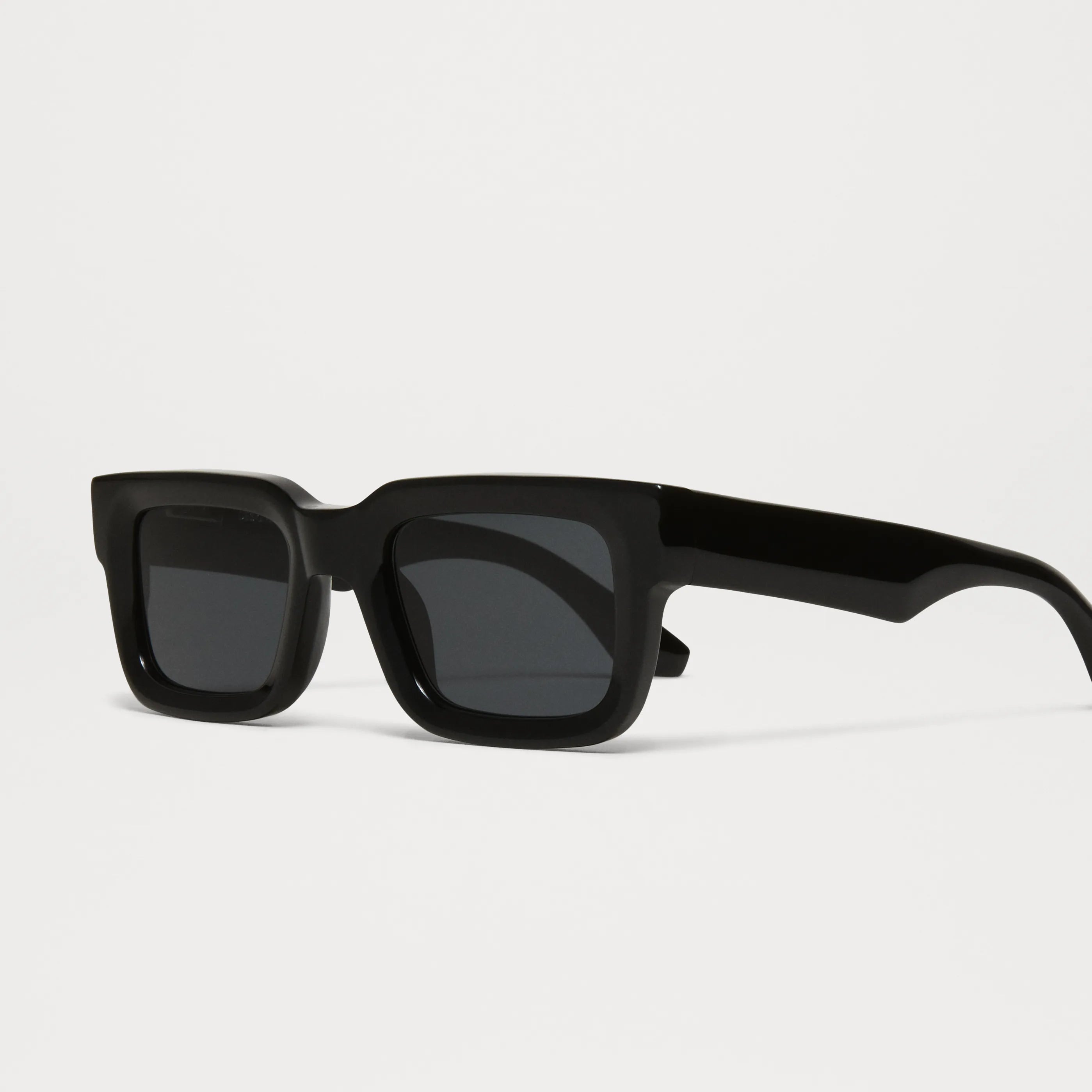 05 Core Black Sunglasses featured in a stylish design with dark lenses and durable acetate frame.