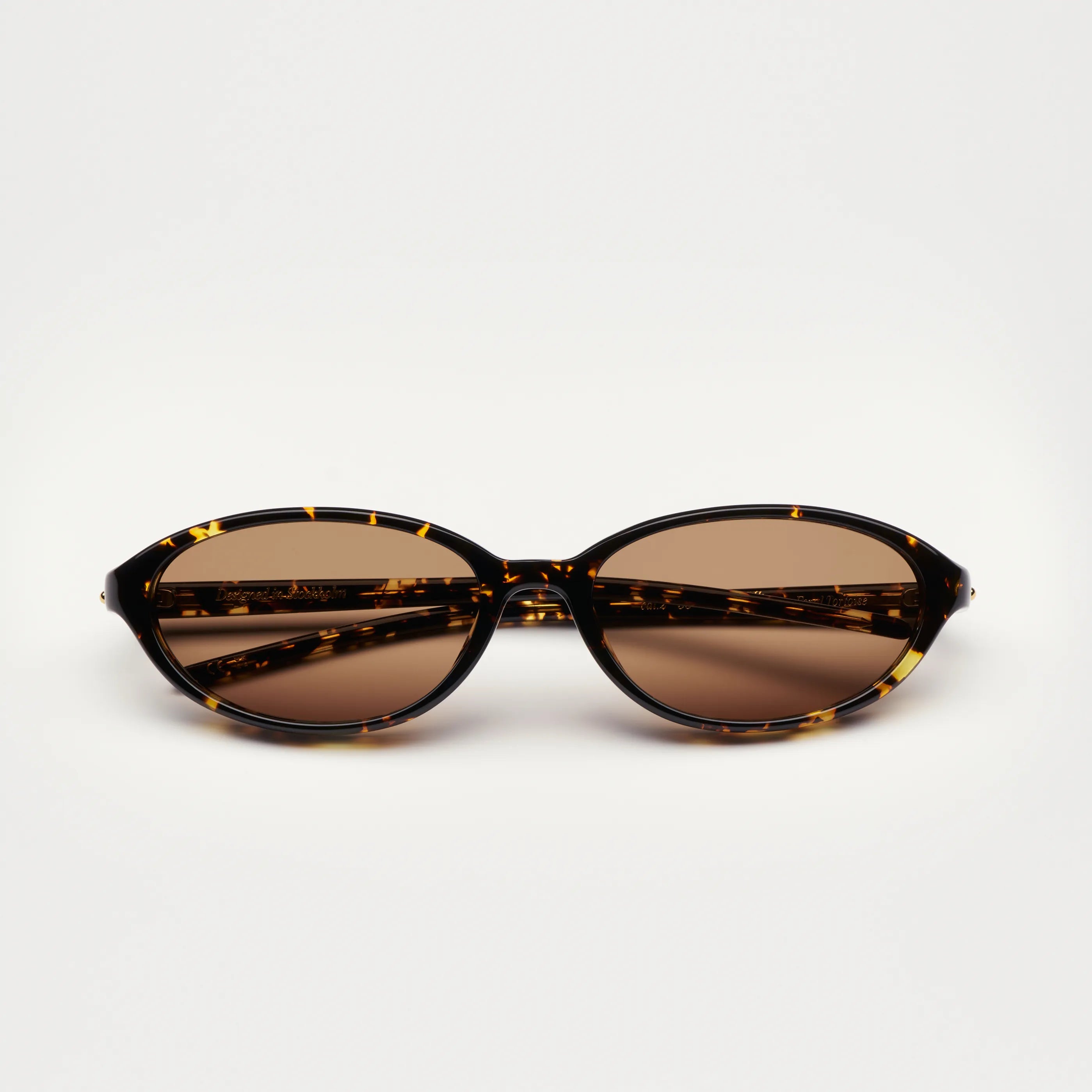 Ellipse Feral Tortoise Sunglasses front view featuring brown anti-scratch lenses and a stylish acetate frame.