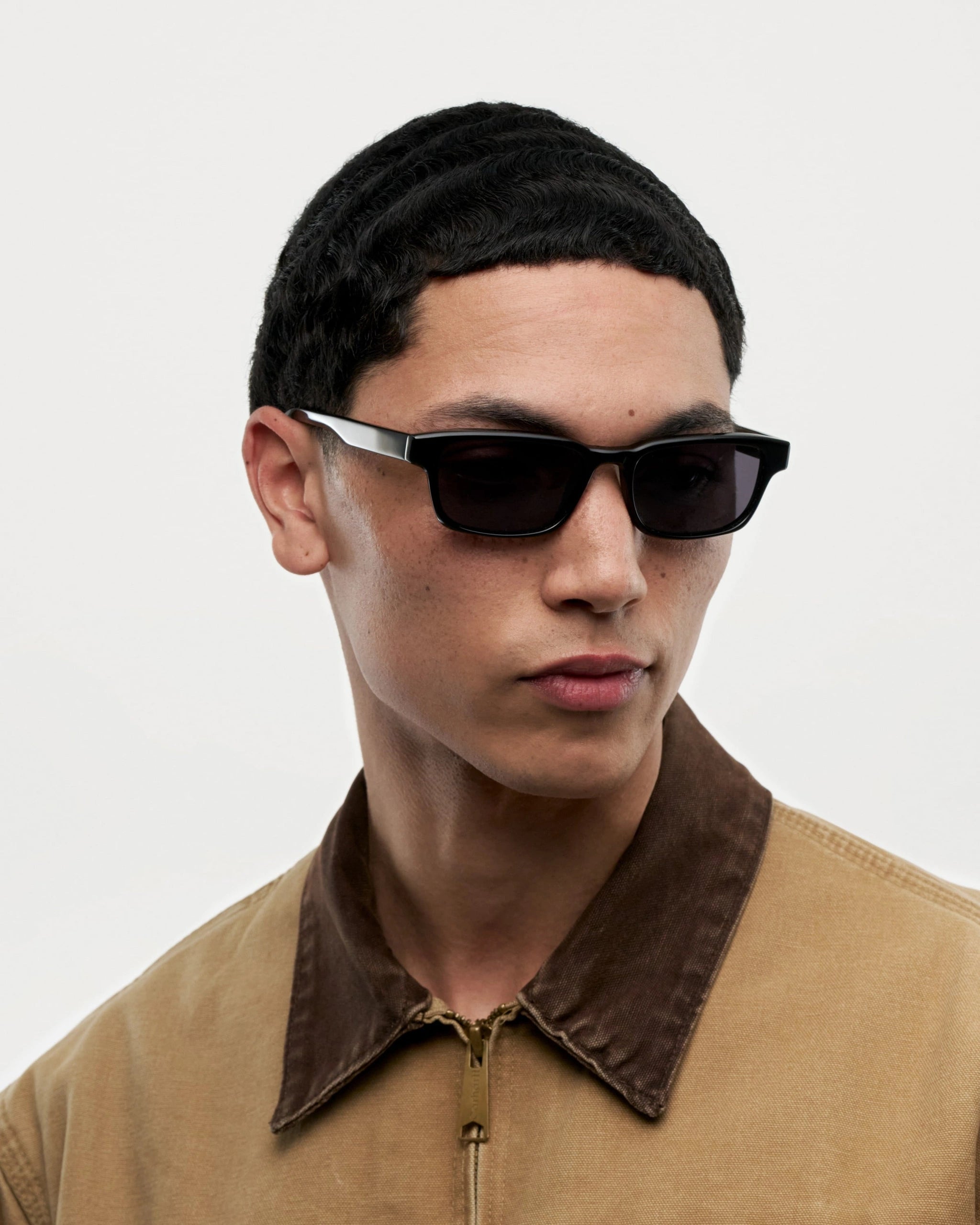 Kasi Black Sunglasses worn by a model showcasing their stylish design and high-quality features.