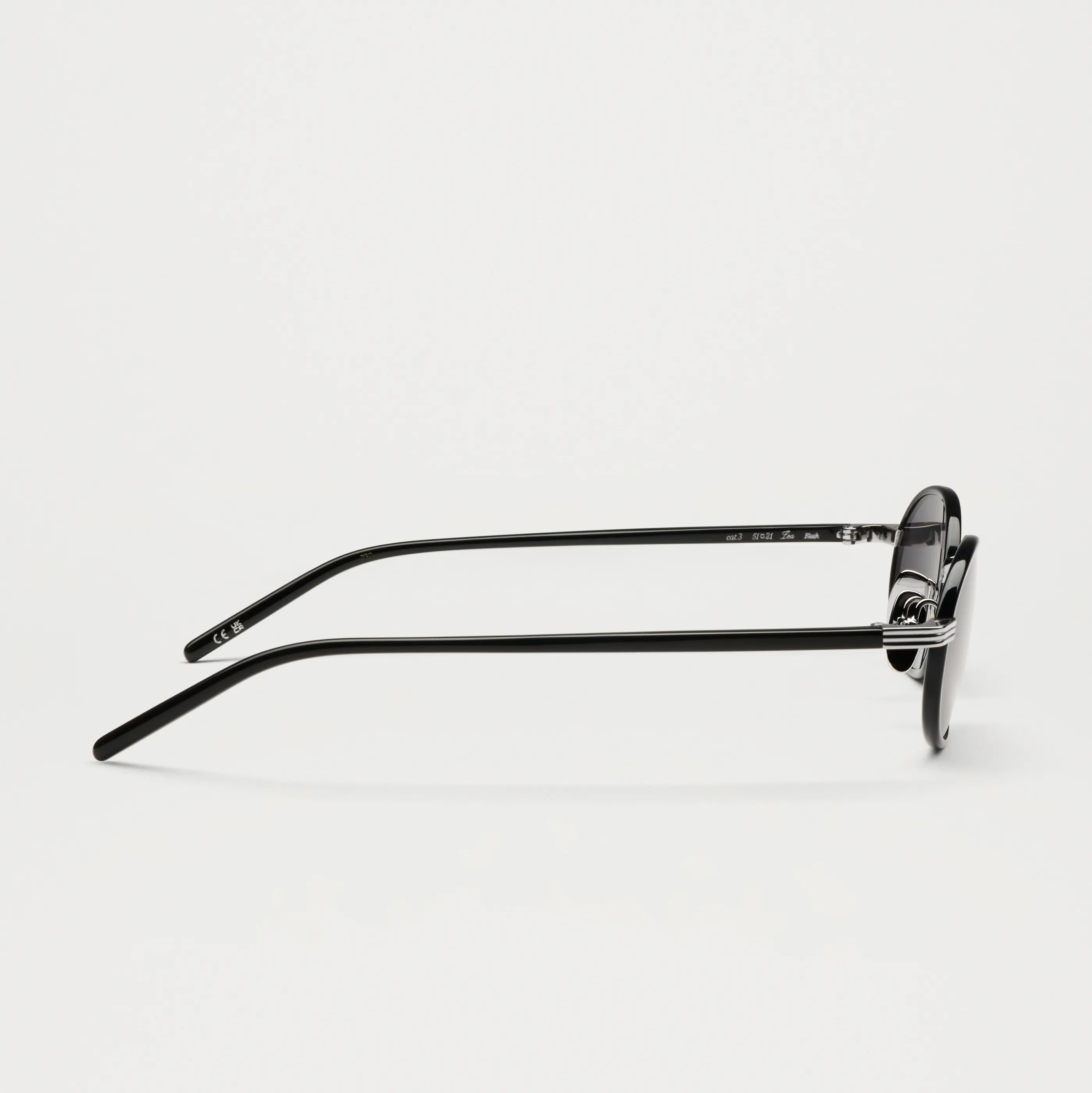 Lea Black Sunglasses showcasing the sleek side profile with durable Acetate Renew™ and metal details.