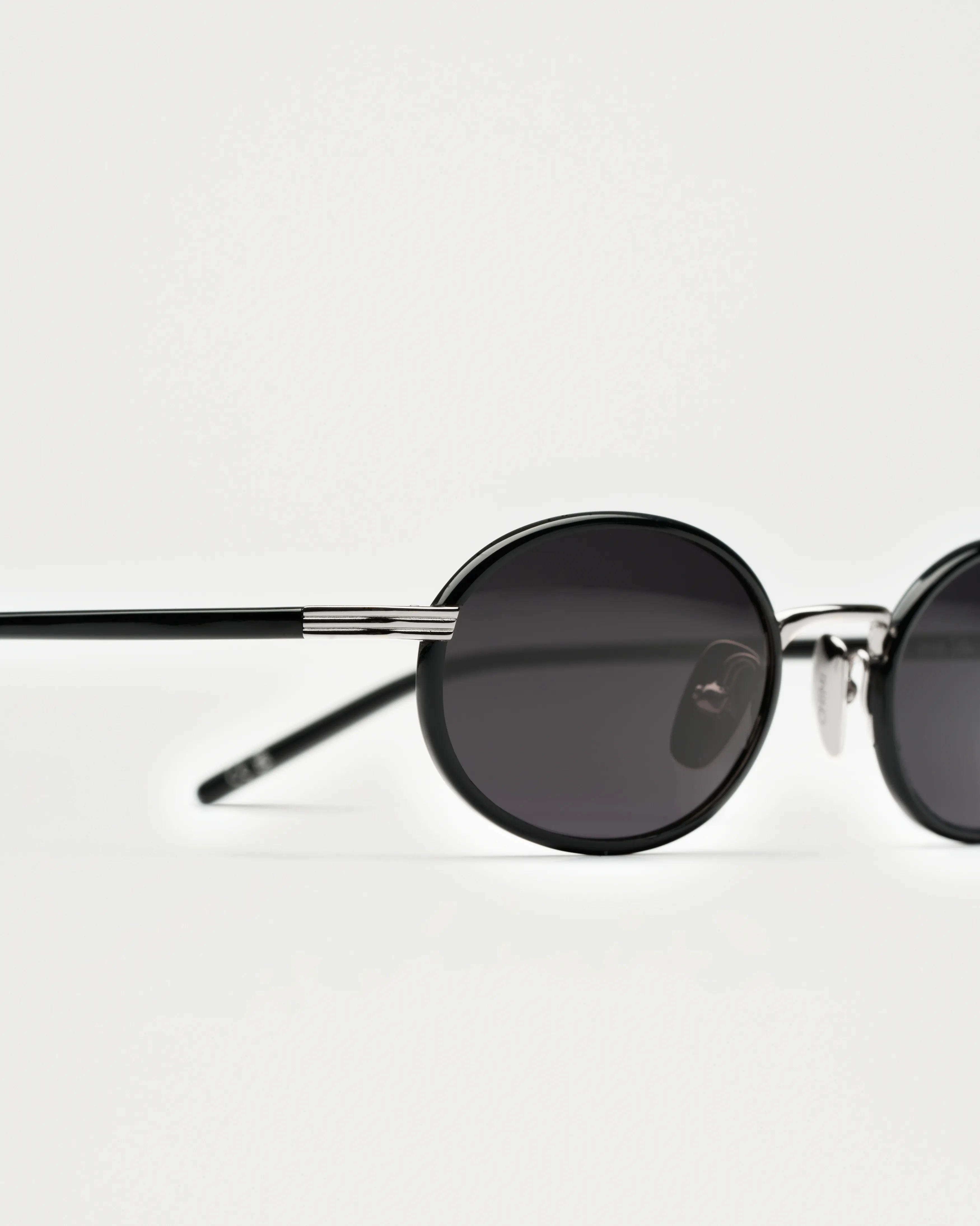 Lea Black Sunglasses showcasing high-quality design with durable Acetate and metal details, offering 100% UVA + UVB protection.