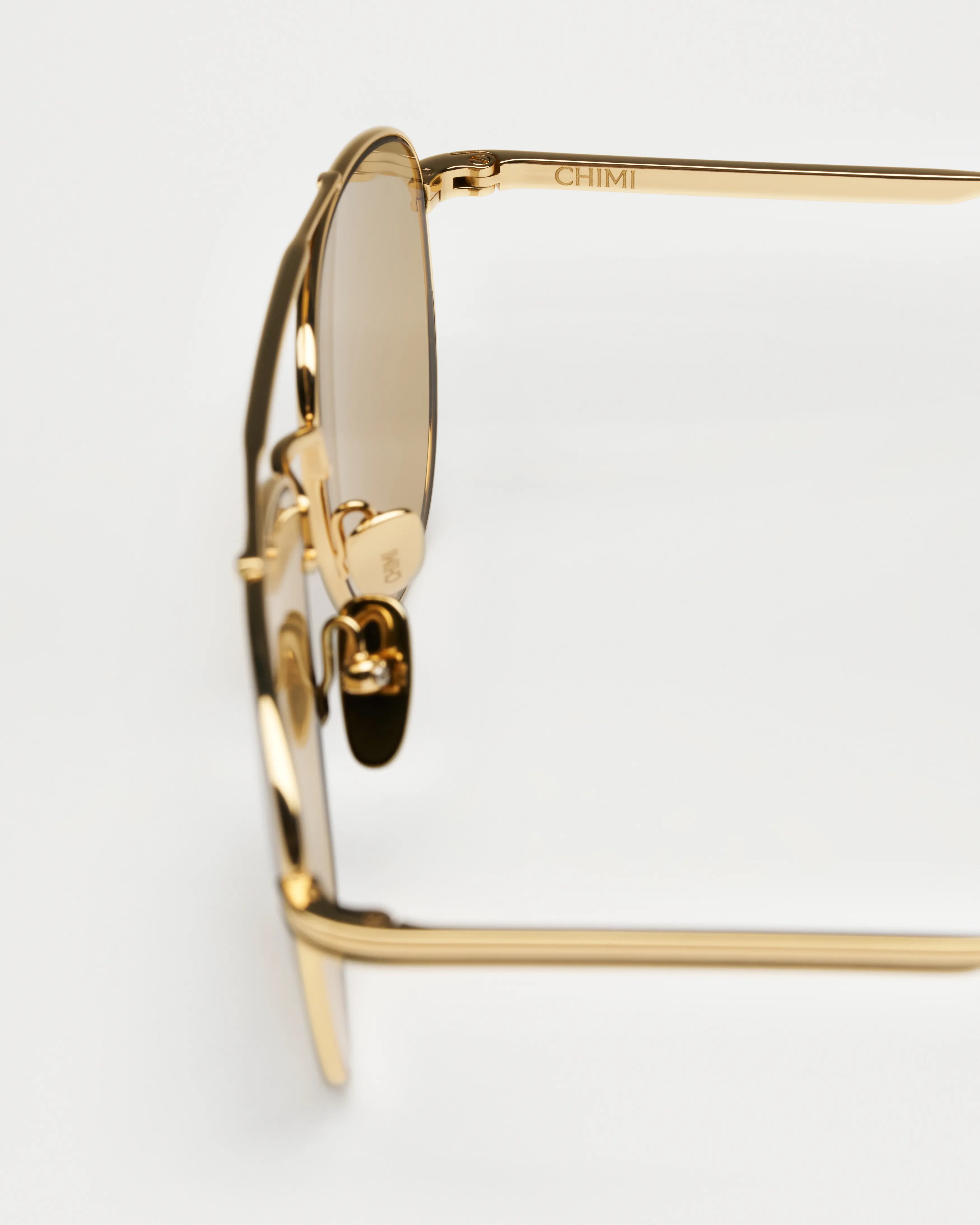 Pantos Gold Sunglasses side view showcasing the stylish design and gold frame.