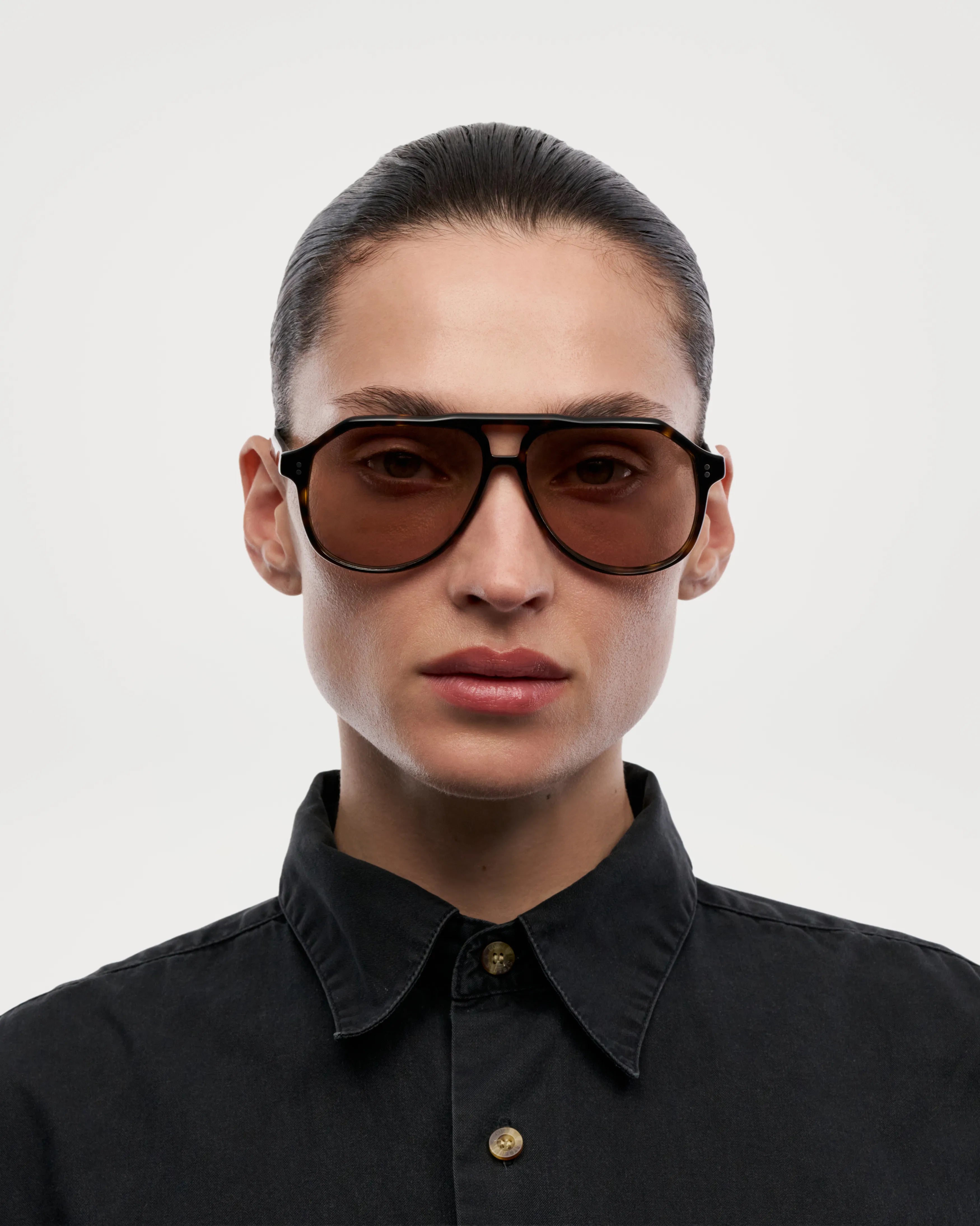 Sally Terra Tortoise Sunglasses worn by a model, featuring anti-scratch lenses and stylish design.