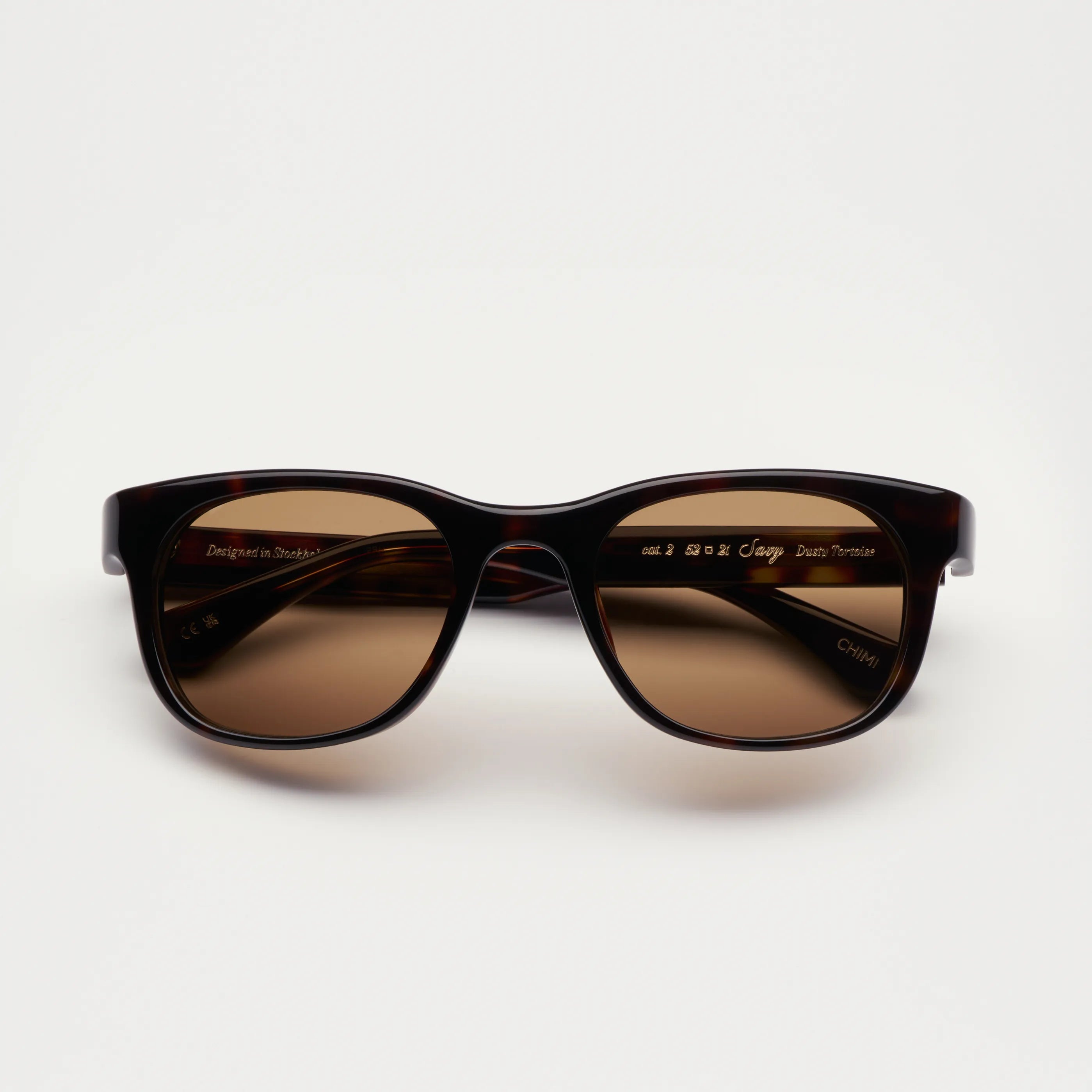 Savy Tortoise Sunglasses with a stylish brown design and UV protection, perfect for summer adventures.