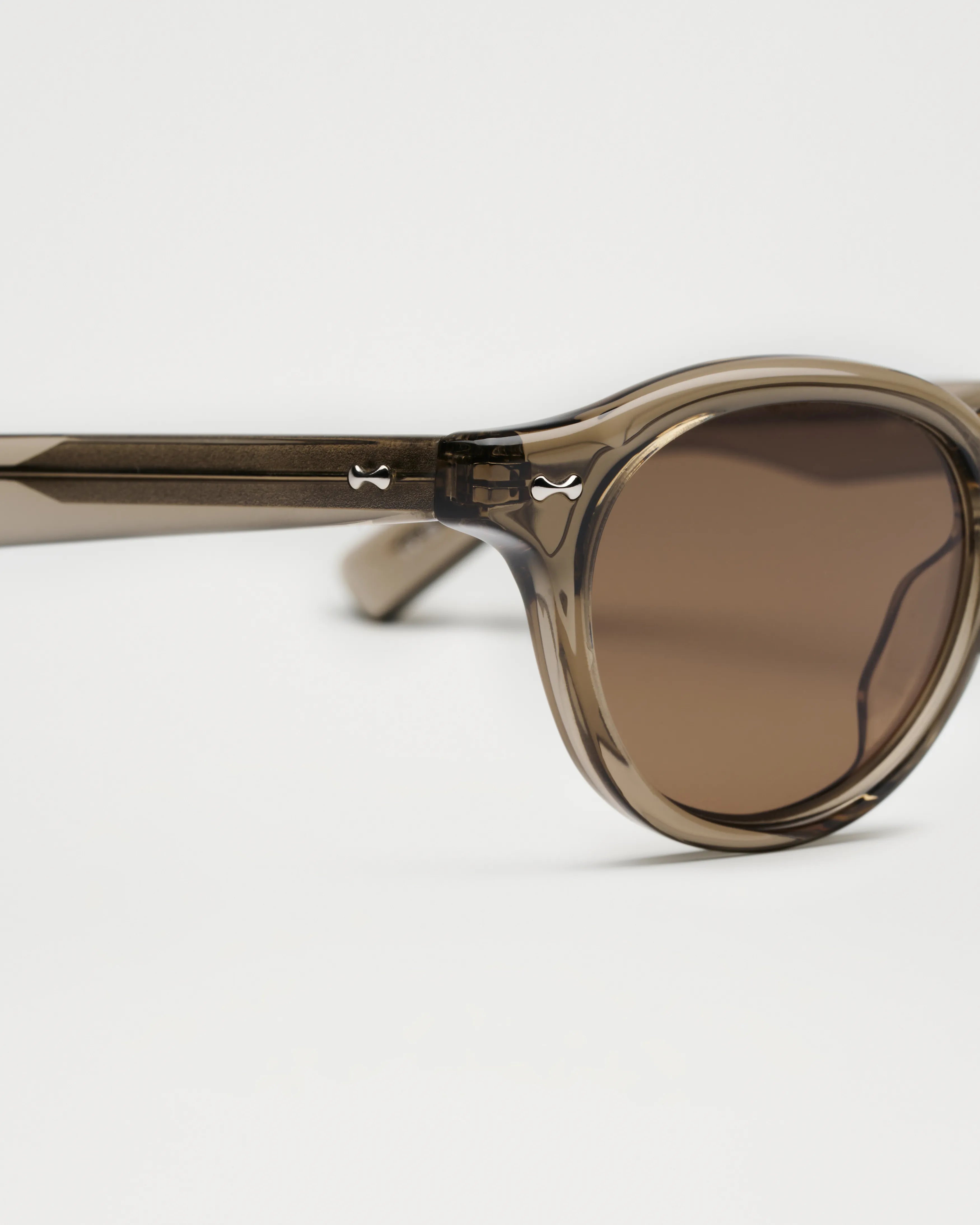 Scope Light Taupe Sunglasses showcasing high-quality design with anti-scratch lenses and durable Acetate material.