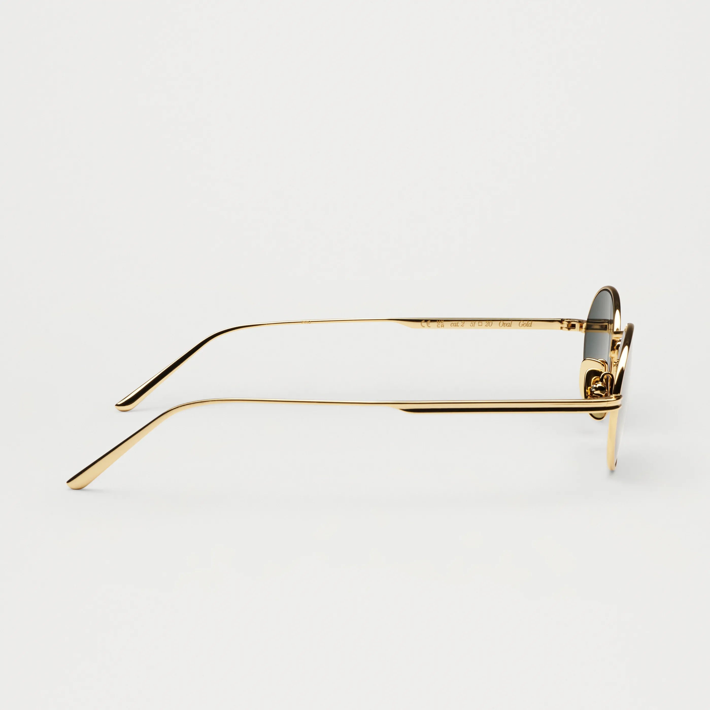 Side view of stylish Oval Gold Sunglasses featuring a sleek bio nylon frame and scratch-resistant lenses.
