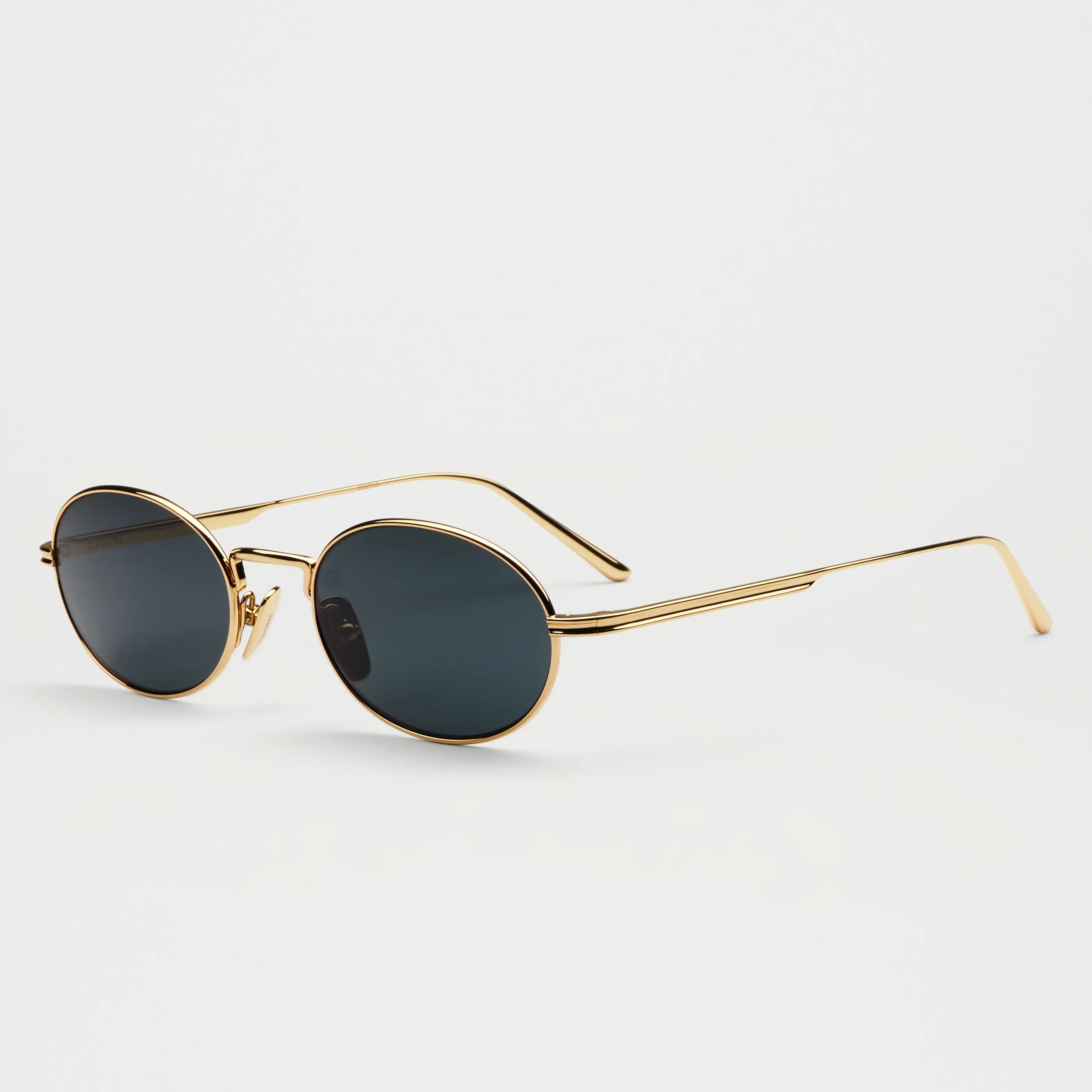 Oval Gold Sunglasses with UV 400 protection, eco-friendly frame, and scratch-resistant lenses.