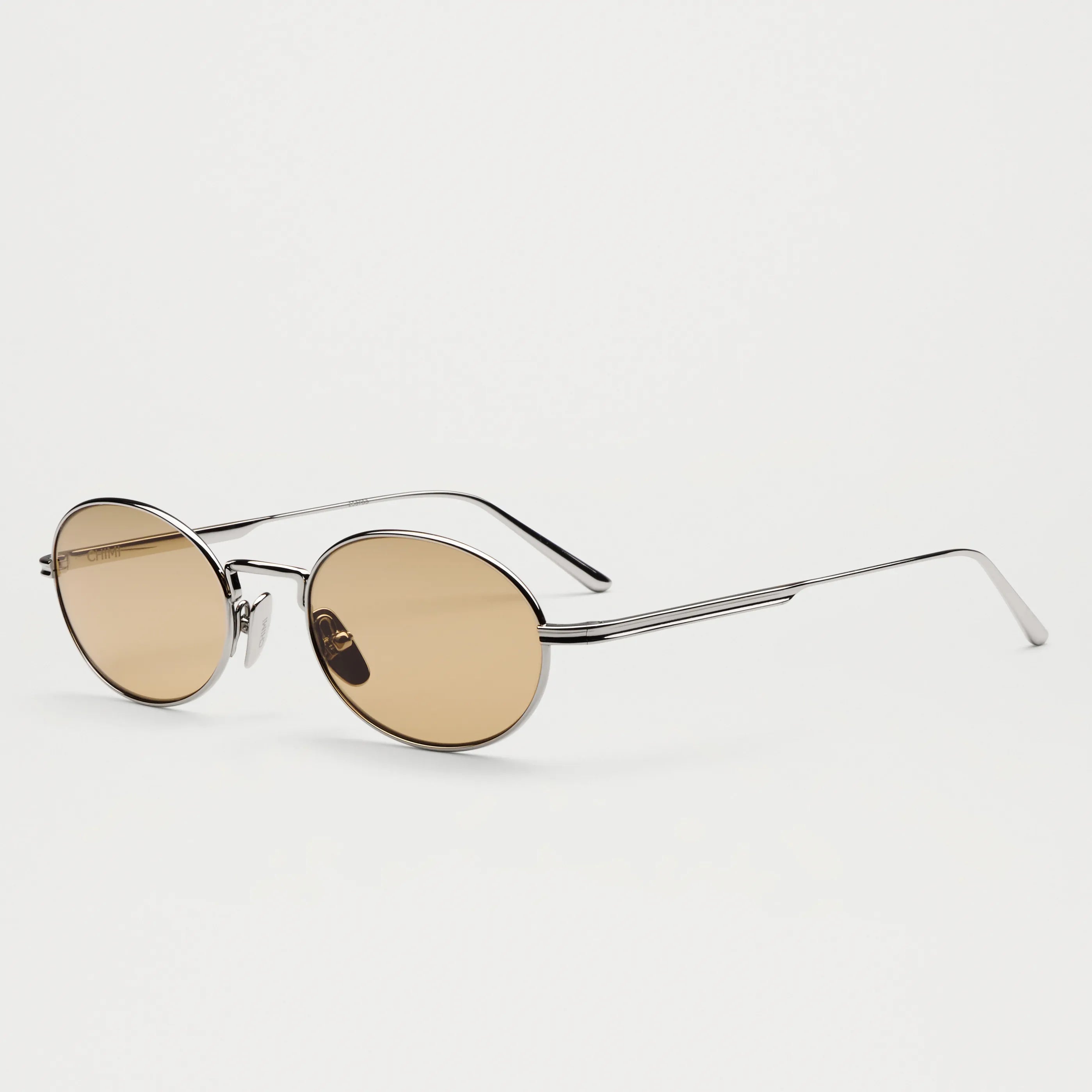 Oval Silver Sunglasses with UV 400 protection, eco-made bio nylon frame, scratch resistant lenses, unisex design.