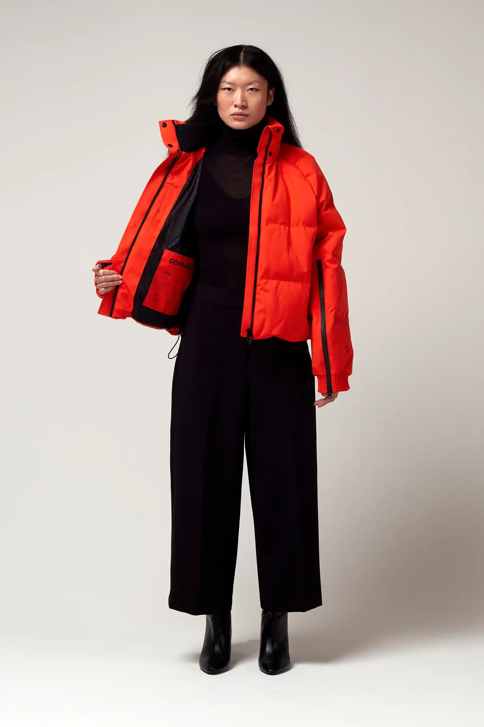 Agasga Poppin Red Coat displayed on model, showcasing waterproof and breathable features in a stylish design.
