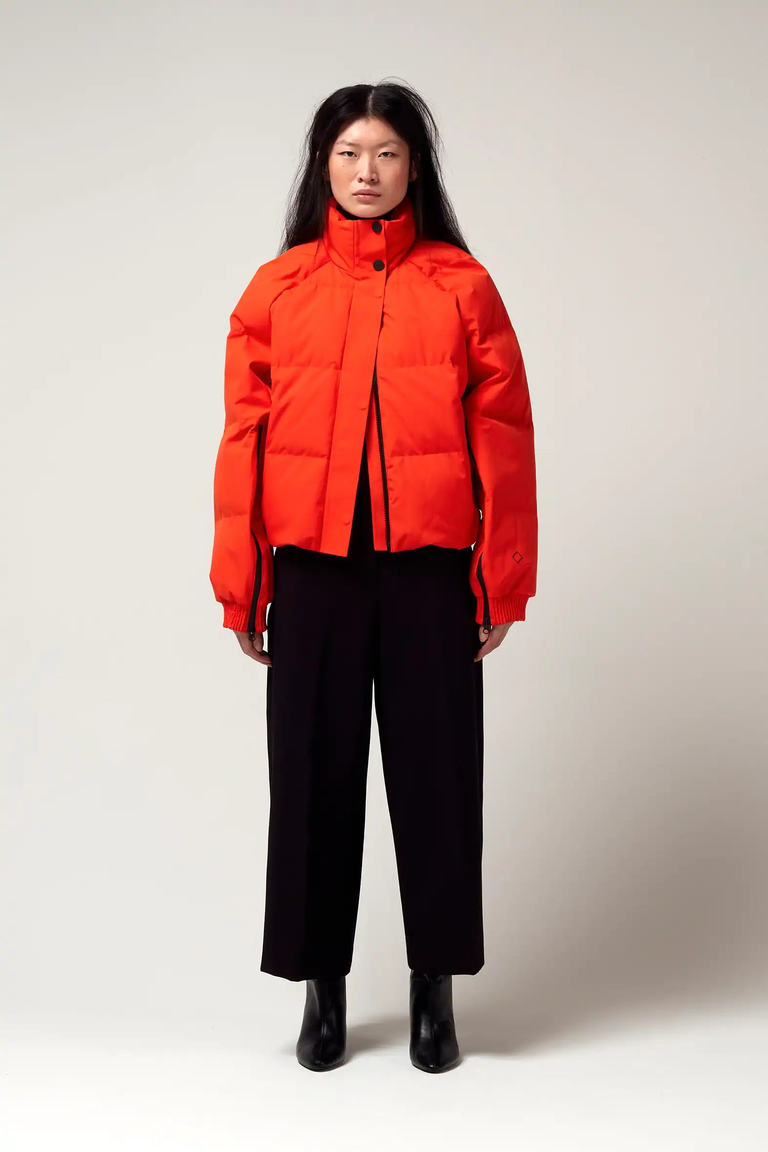 Agasga Poppin Red Coat worn by model, showcasing its vibrant color and stylish design.