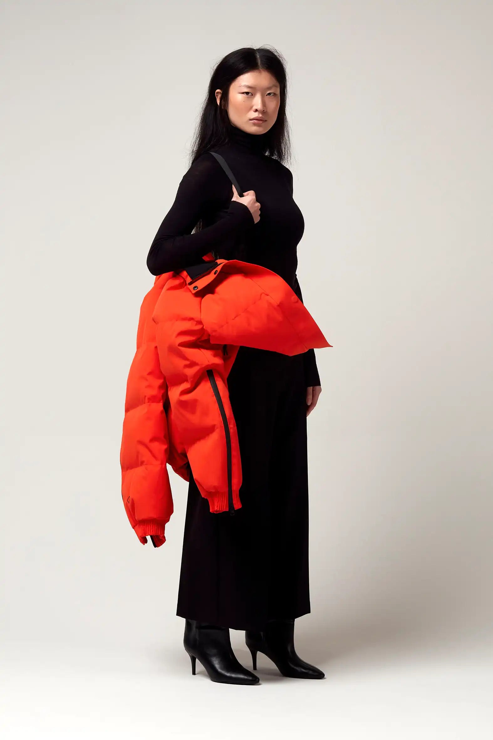 Agasga Poppin Red Coat worn by a model, showcasing its vibrant color and stylish design.