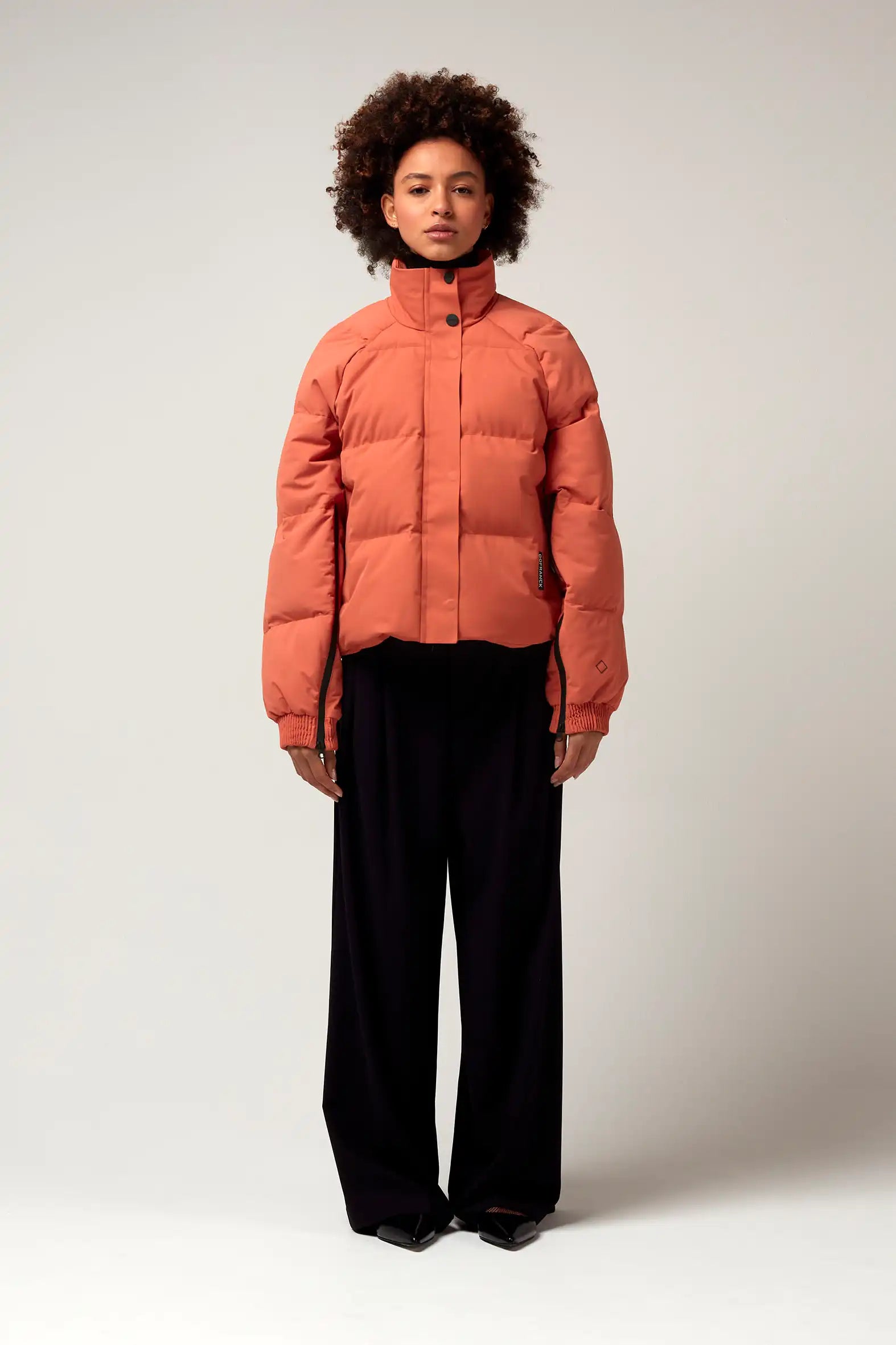 Model wearing the Agasga Apricot Coat, showcasing its lightweight and stylish design.