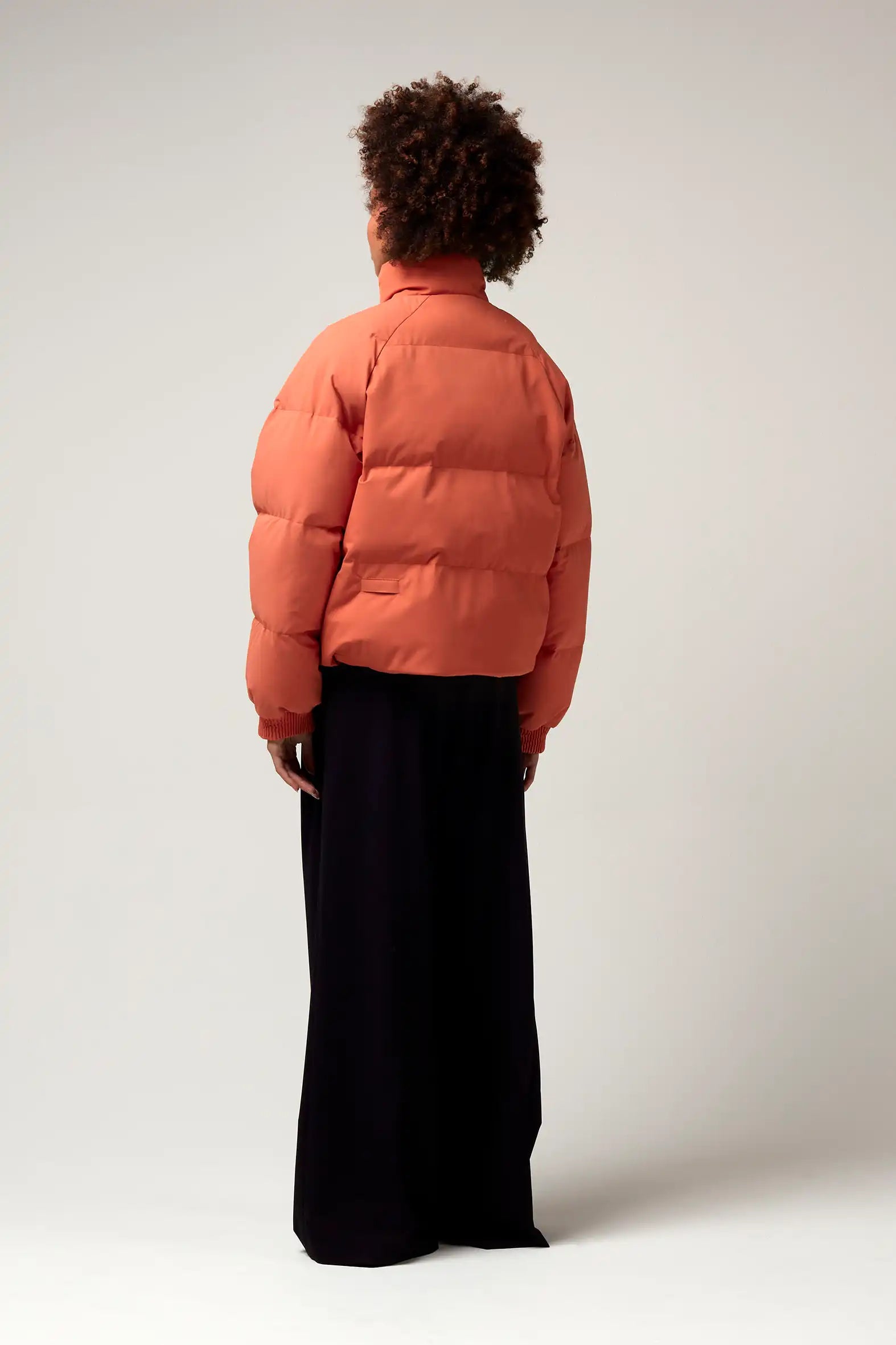 Agasga Apricot Coat worn by model from the back, showcasing its stylish design and lightweight ripstop fabric.