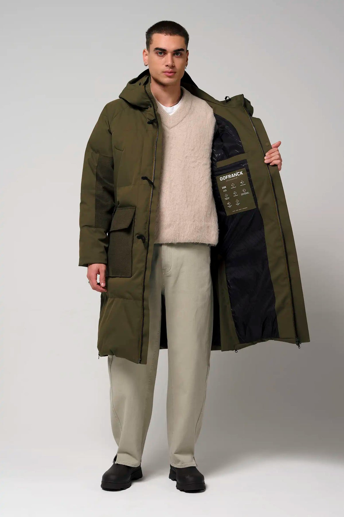 Barack Dark Olive Green Parka showcased by a model, featuring a stylish design and functional pockets.