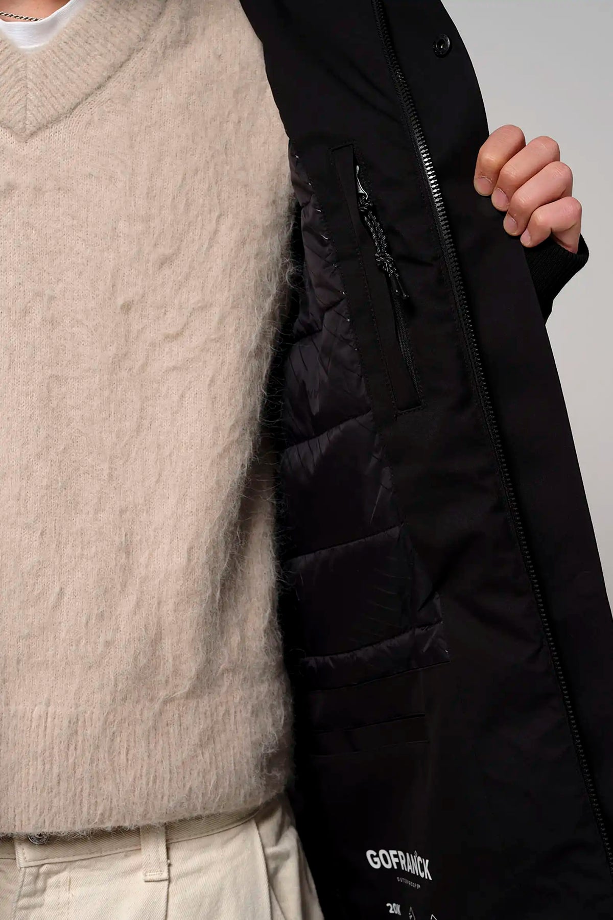 Cielo Deep Black Coat featuring a cozy inner lining and functional pockets, ideal for chilly weather.