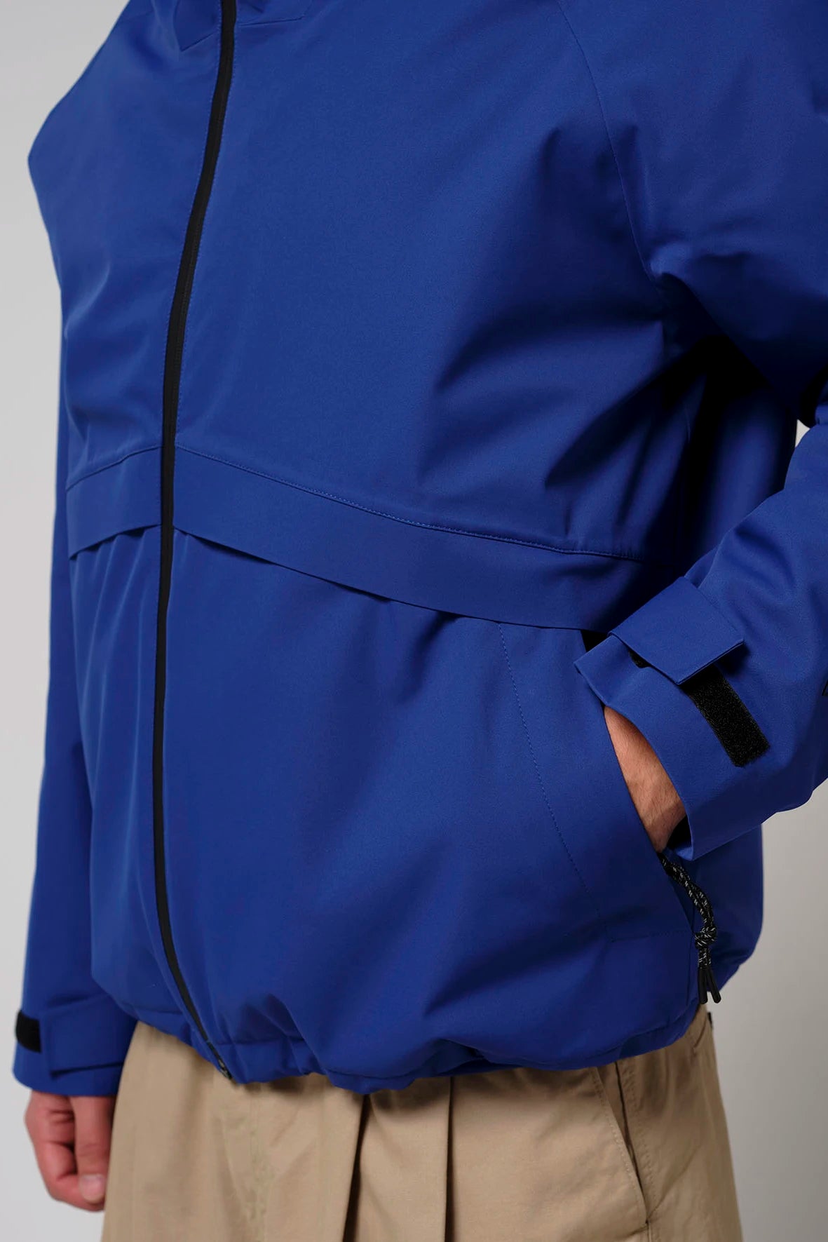 Claud Sodalite Blue Coat shown in a close-up, featuring a stylish design and practical pockets.