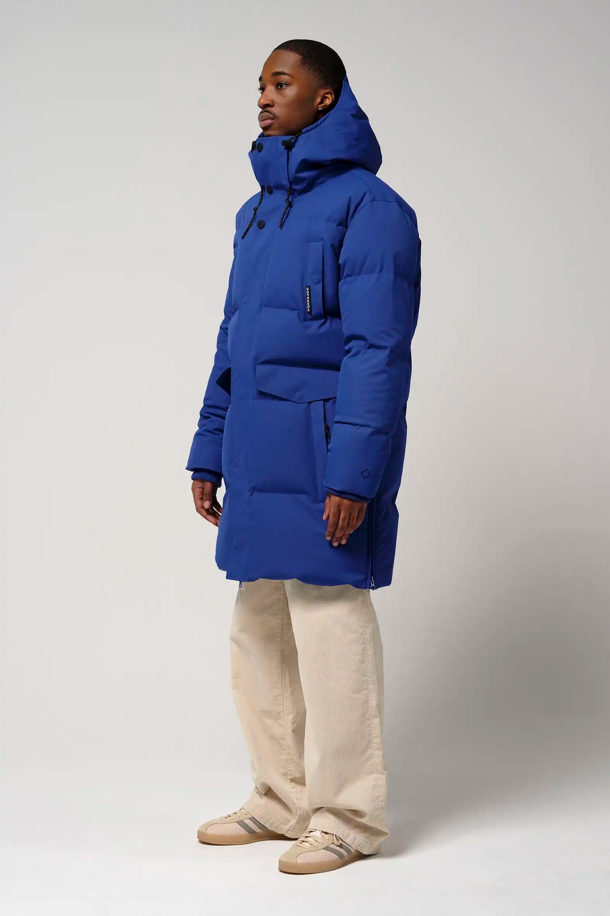 Model wearing Climate Sodalite Blue Coat, showcasing its stylish design and practical features.