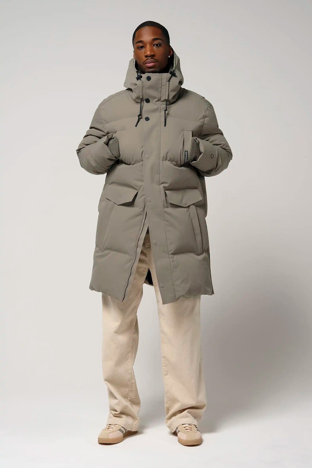 Model wearing the Climate Timber Wolf Grey Coat, highlighting its waterproof and breathable design.