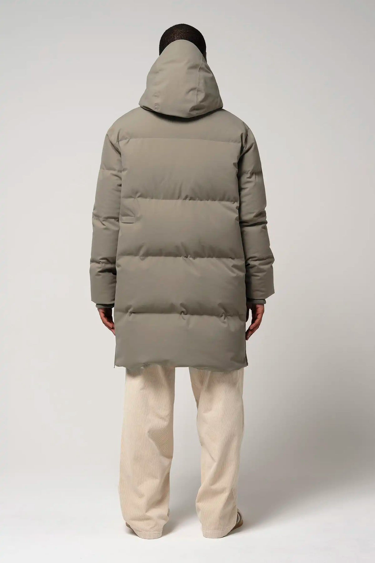 Climate Timber Wolf Grey Coat back view on model wearing beige pants.