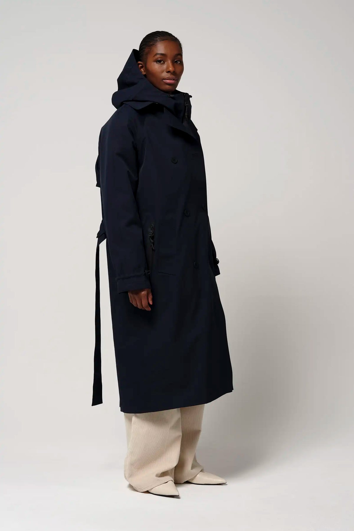 Gale Sky Captain Blue Parka modeled by a woman, showcasing its casual fit, hood, and stylish design.