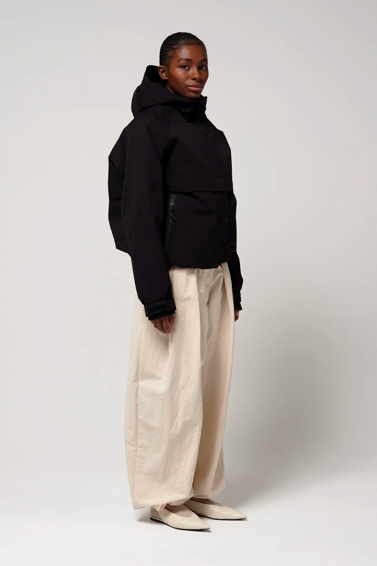 Guthrie Deep Black Coat worn by a model, showcasing its waterproof and windproof features.