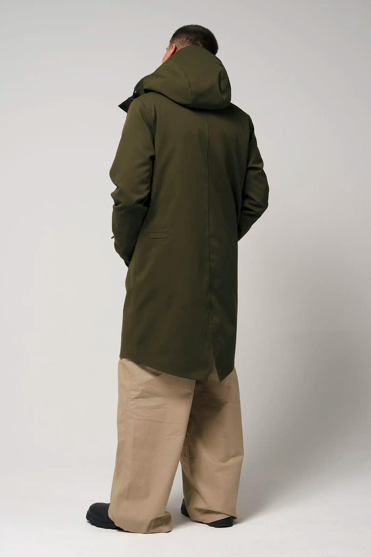 Raiden Dark Olive Green Parka back view showing adjustable hood and windproof design.
