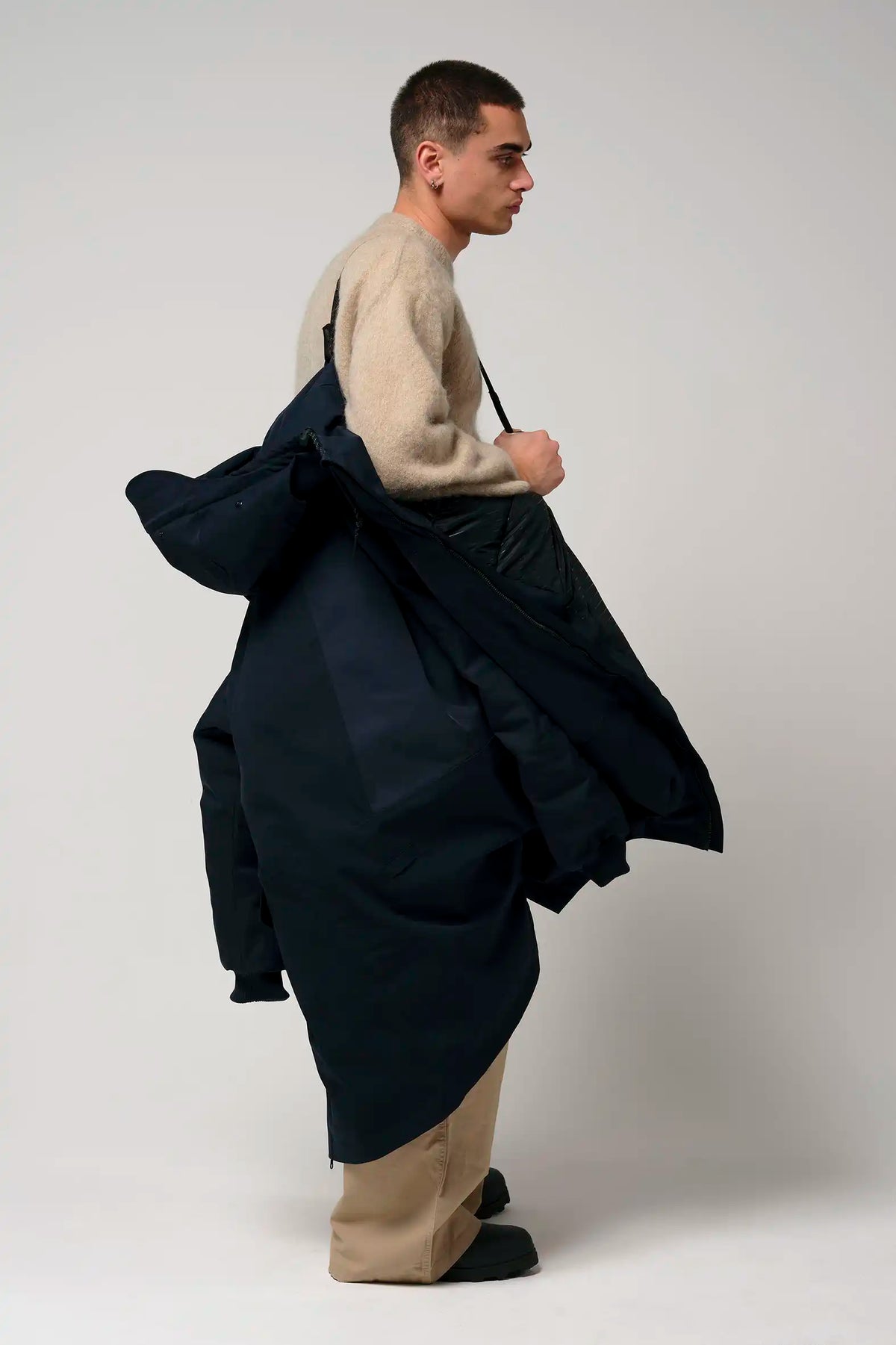 Stratus Sky Captain Blue Parka on a model, highlighted for its waterproof, windproof, and breathable features.