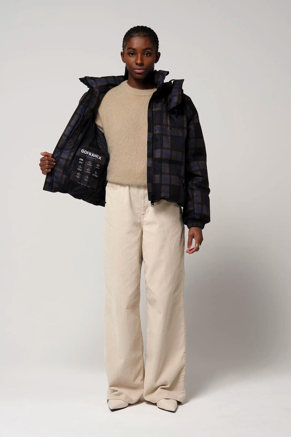 Talon Blue Tartan Check Coat worn by model, highlighting its stylish design and adjustable features.