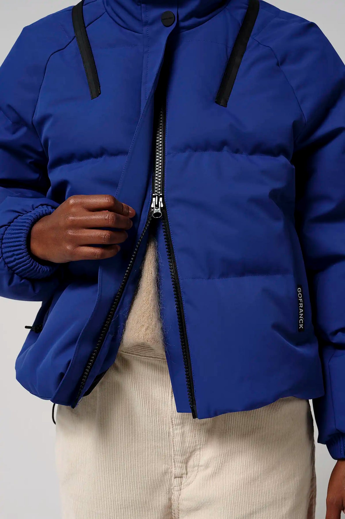 Talon Sodalite Blue Coat featuring a zipper and adjustable elements for style and comfort.