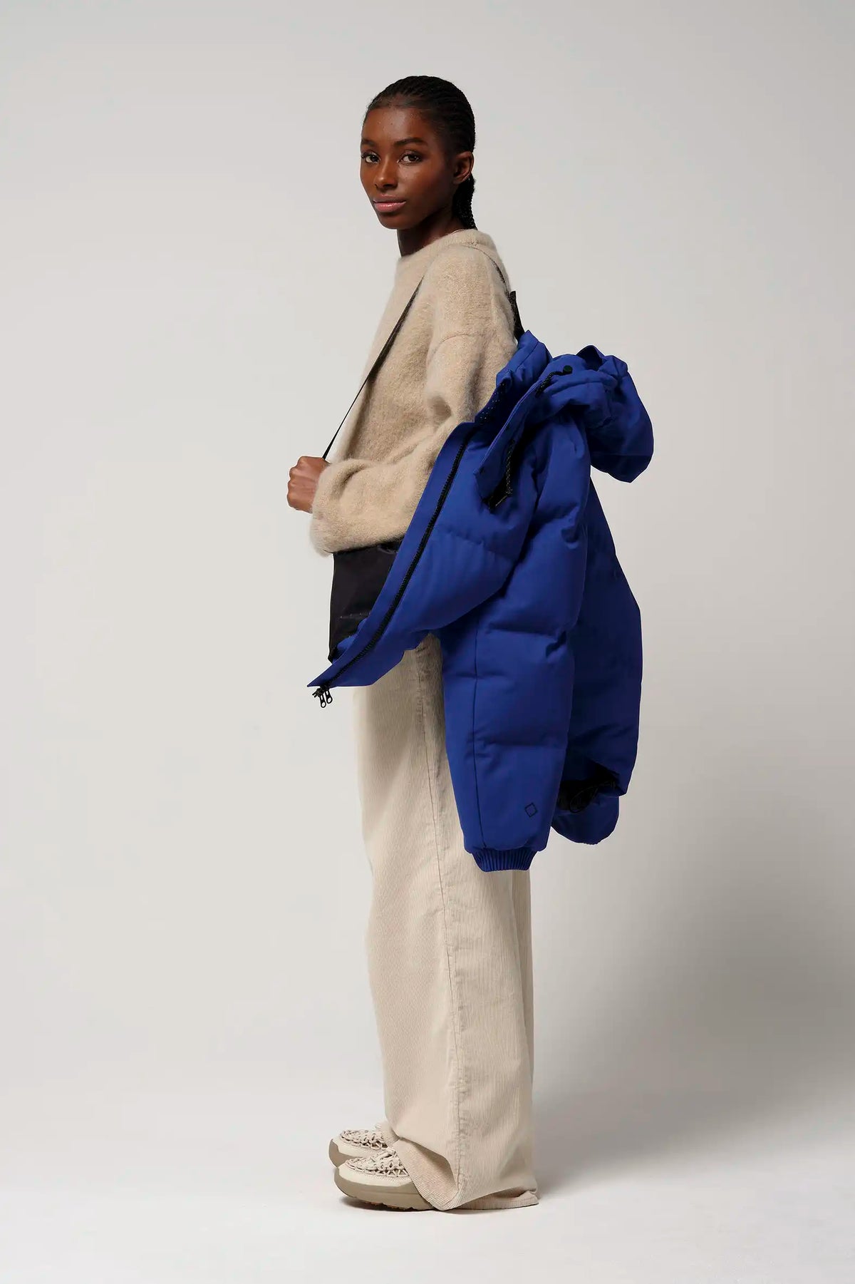 Model showcasing Talon Sodalite Blue Coat, featuring a modern and stylish design. Ideal for all weather conditions.
