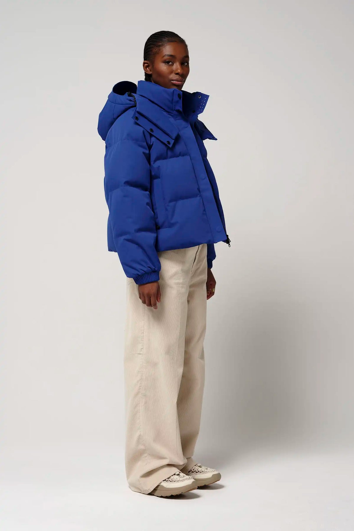 Talon Sodalite Blue Coat worn by a model, showcasing its stylish design and vibrant blue color.