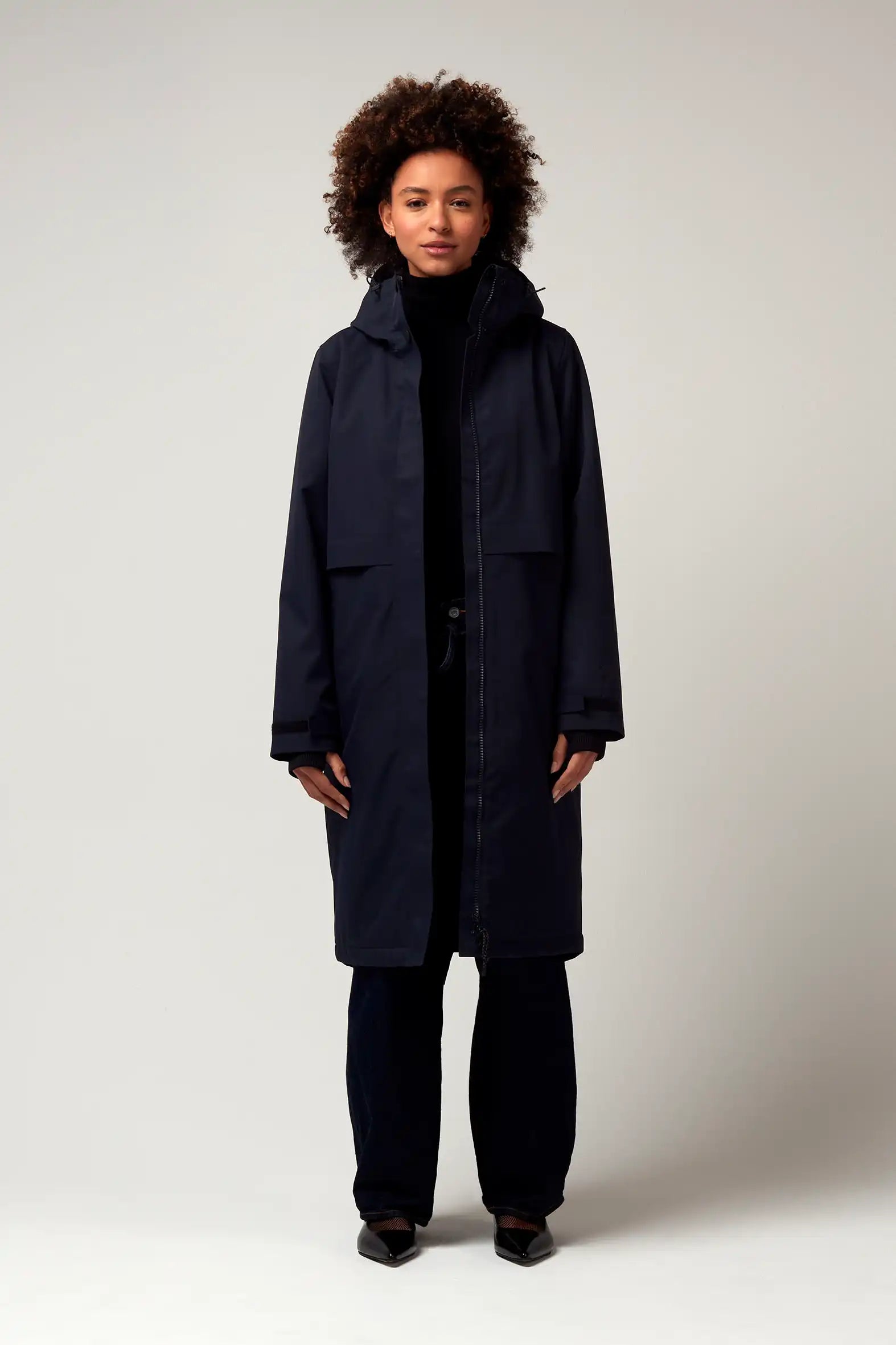 Model wearing Nebula Sky Captain Blue Coat, showcasing its stylish design and functional features.