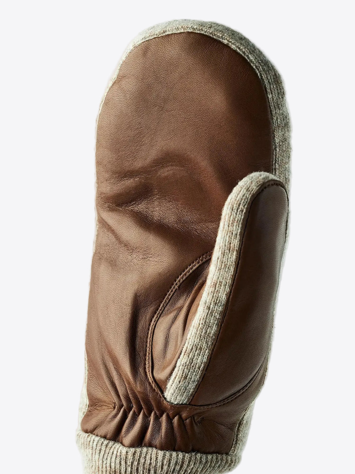 Close-up of Hestra Jeanne Mitt Light Brown Gloves showcasing leather and wool design.