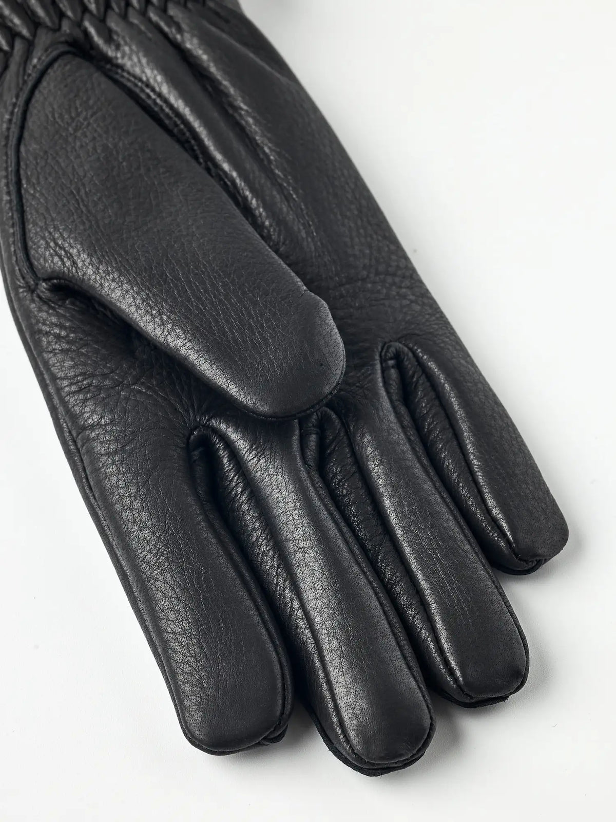 Tiril Black Gloves by Hestra, supple deerskin leather gloves with soft wool lining for warmth.