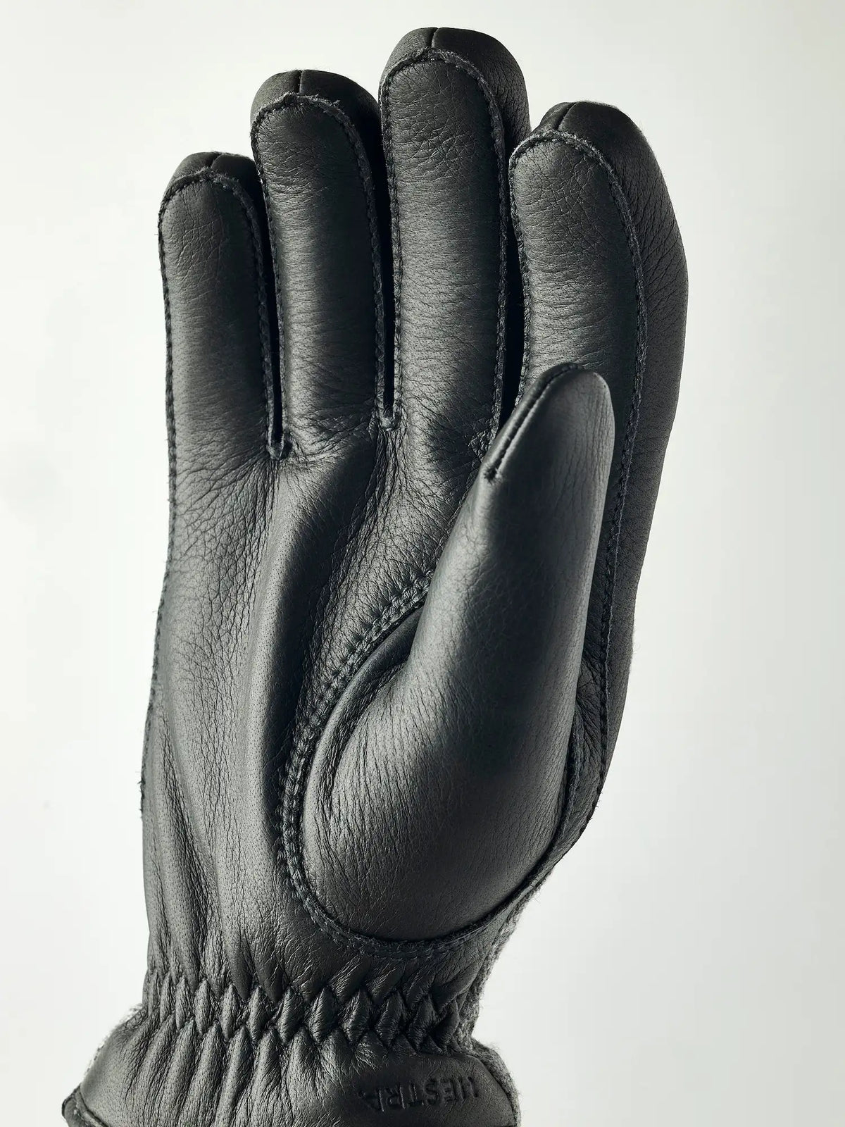 Wilhelm Grey Gloves by Hestra, men's winter gloves made of supple elk leather, showcasing a warm and durable design.