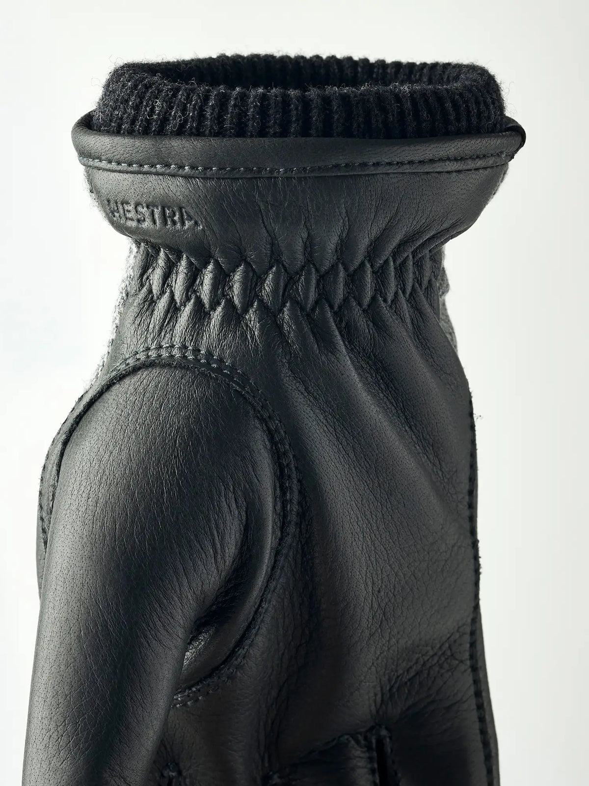 Wilhelm Grey Gloves by Hestra featuring supple elk leather and a cozy knitted cuff design.