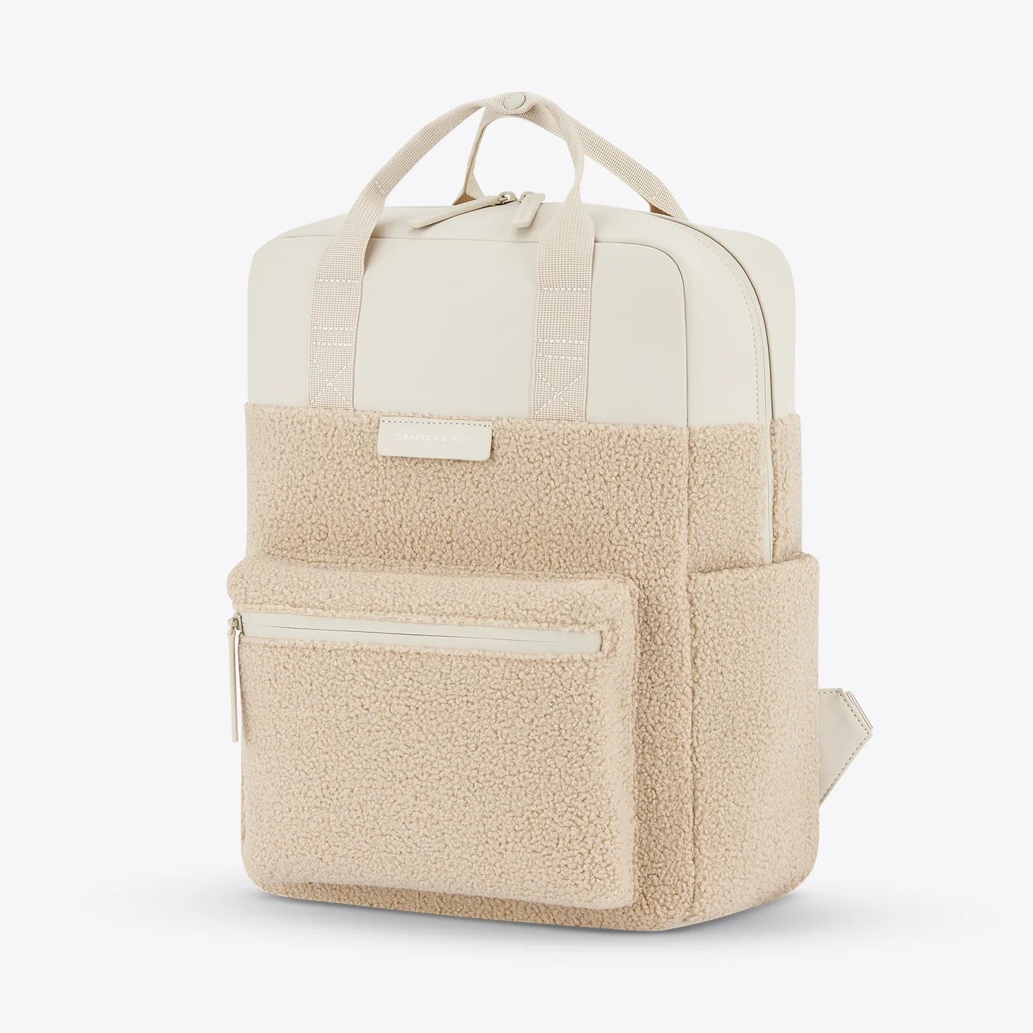 Bergen Pro Fleece Sandstone Backpack in soft teddy fleece, featuring water-resistant material and multiple pockets.