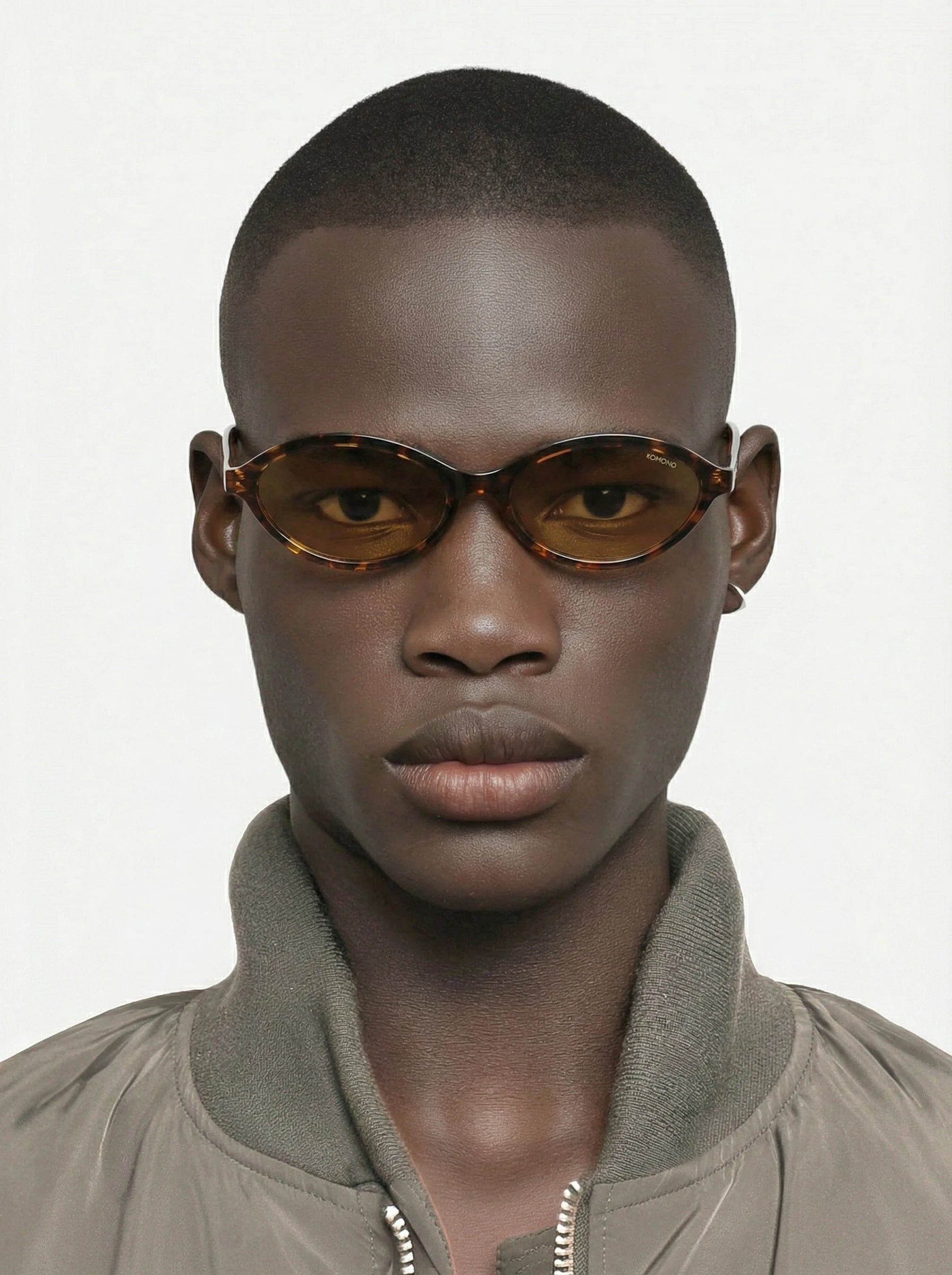 Doris Havana Amber Sunglasses worn by a model, featuring a unisex design and UV 400 protection.