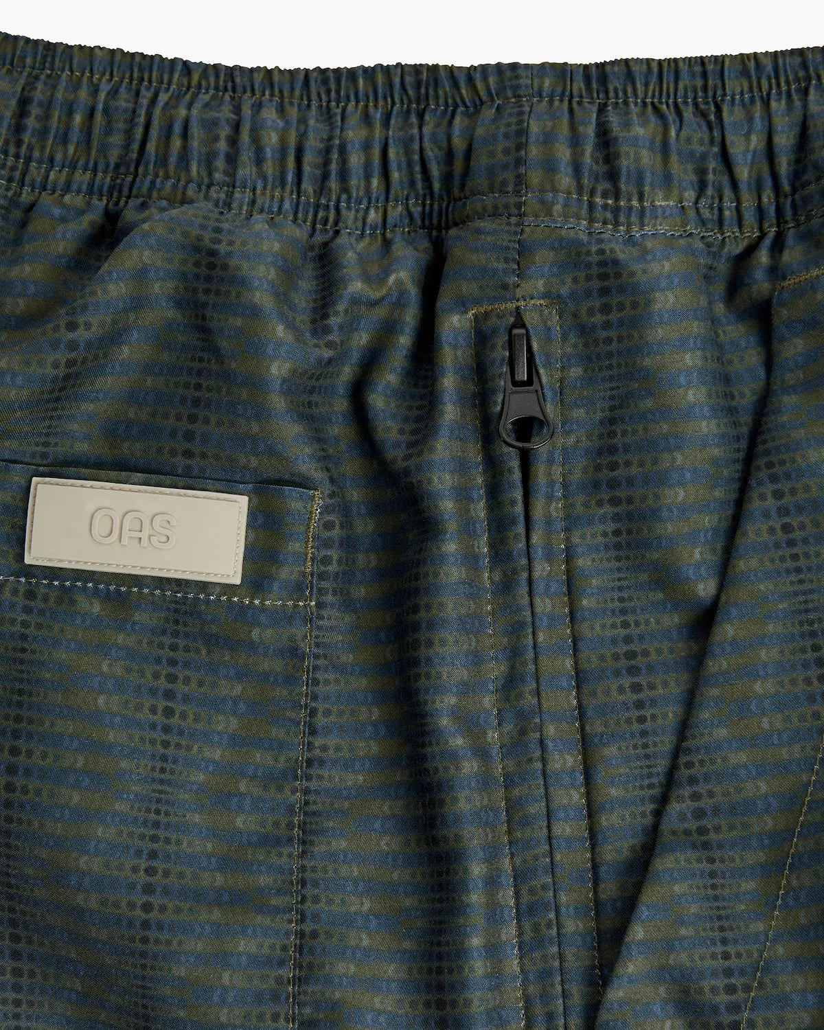 Getrick Swim Shorts back view showing elastic waist and zip pocket detail on lightweight fabric.
