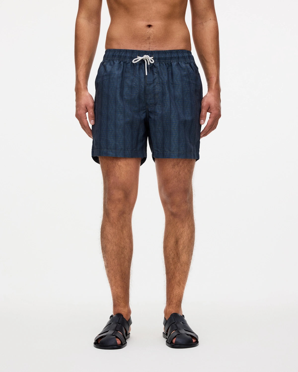 Model wearing Getrick Swim Shorts, lightweight and quick-drying with four pockets and elastic waist.