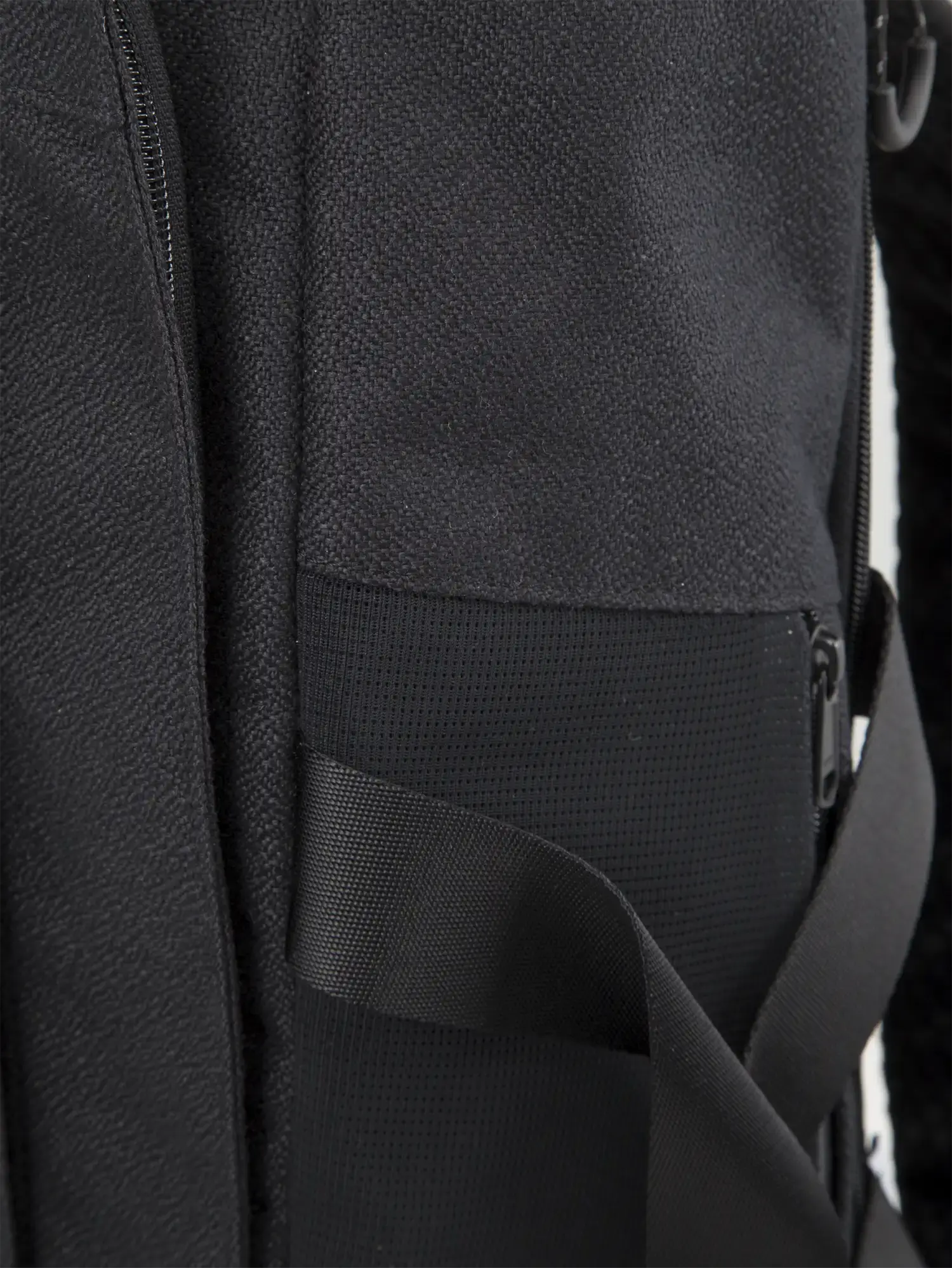 Blok Large Licorice Black Backpack side view showing durable fabric and zipper details.