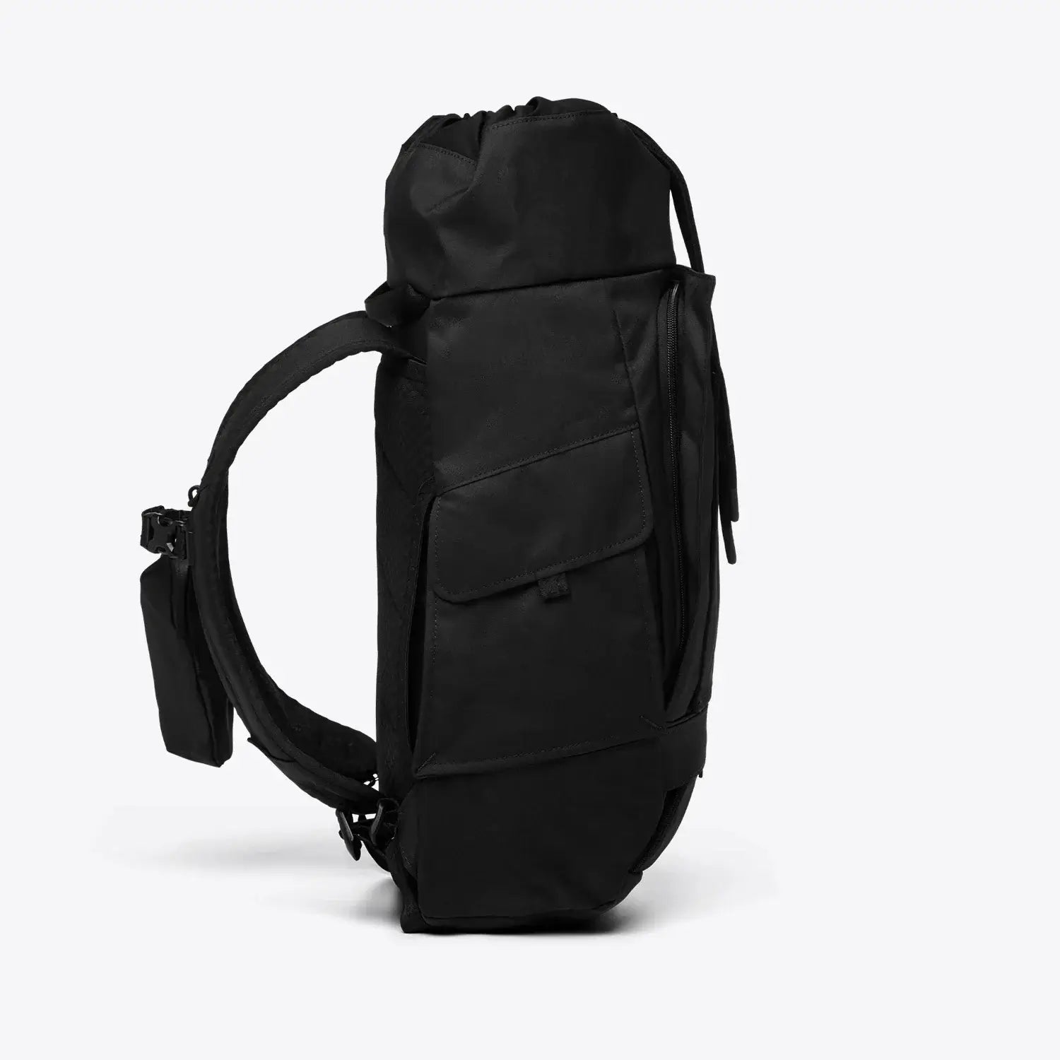 Blok Medium Construct Black Backpack side view showcasing multiple zippers and compartments.