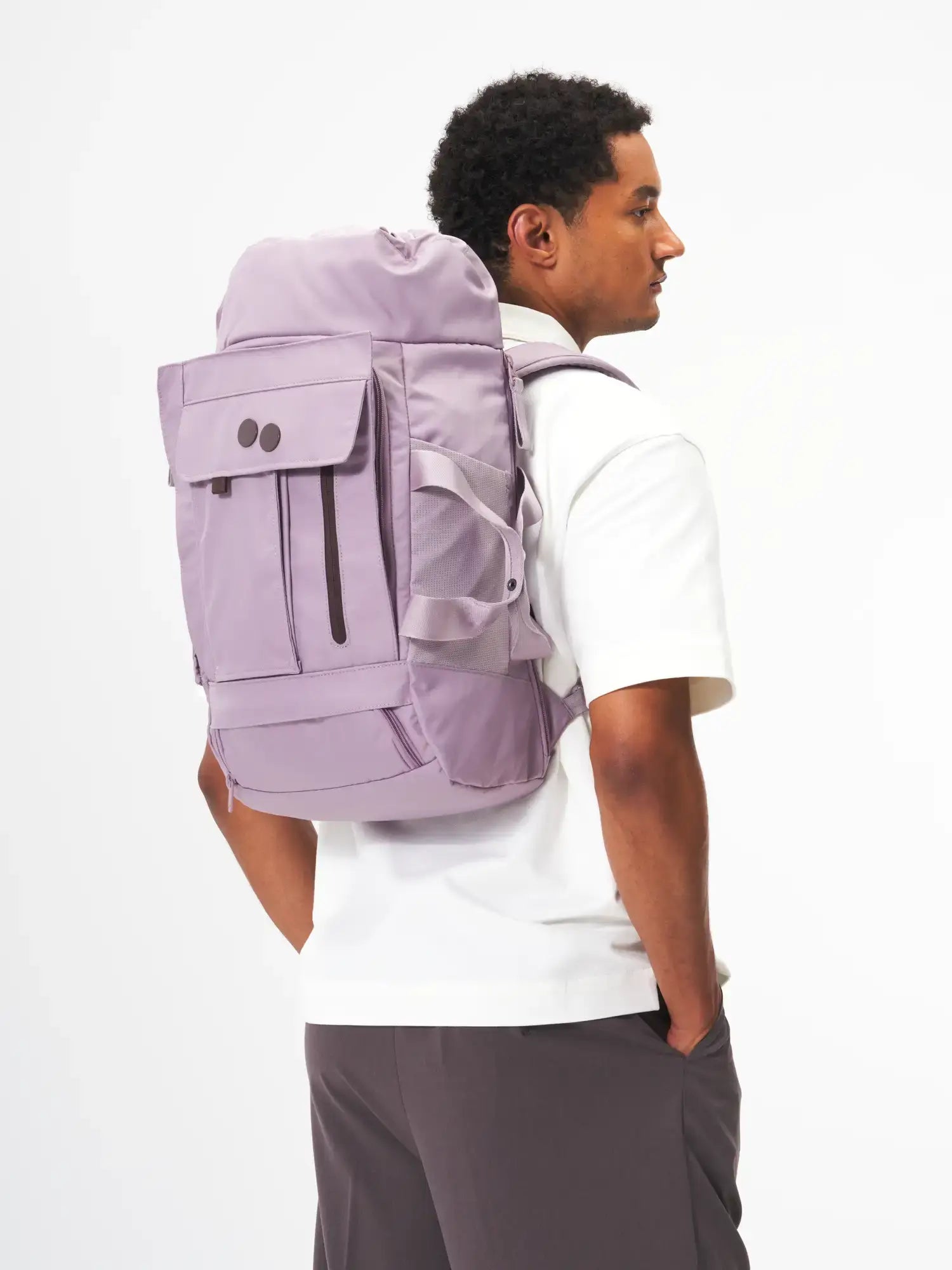 Blok Medium Construct Lilac Backpack worn by a model, showcasing its multiple access points and storage options.