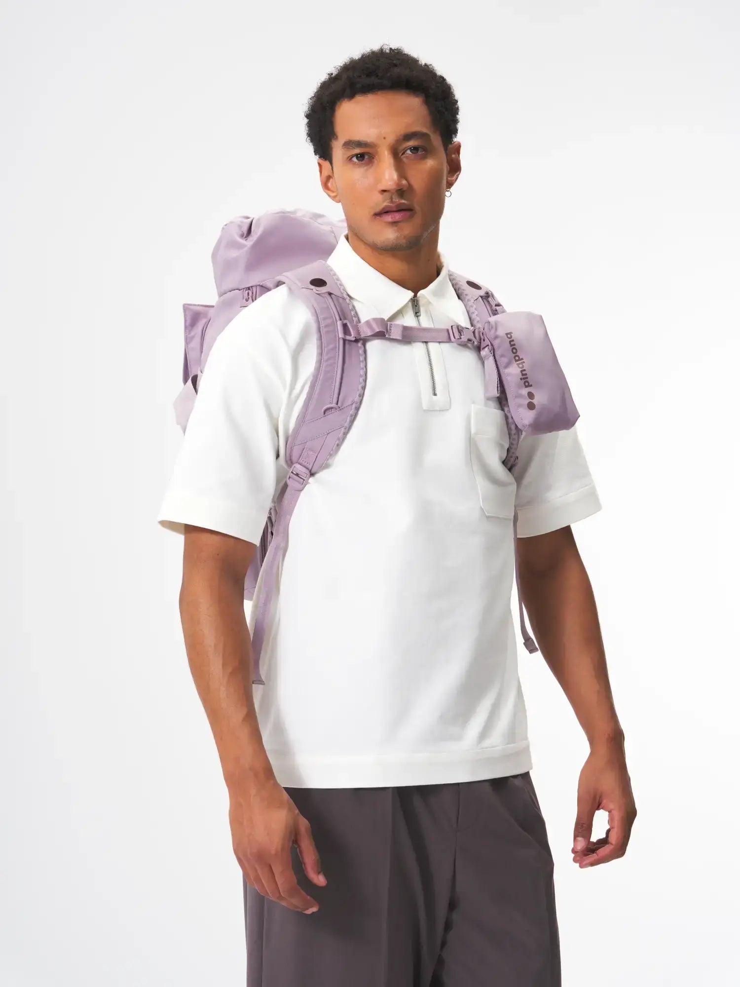 Blok Medium Construct Lilac Backpack worn by a model, demonstrating its stylish and functional design.