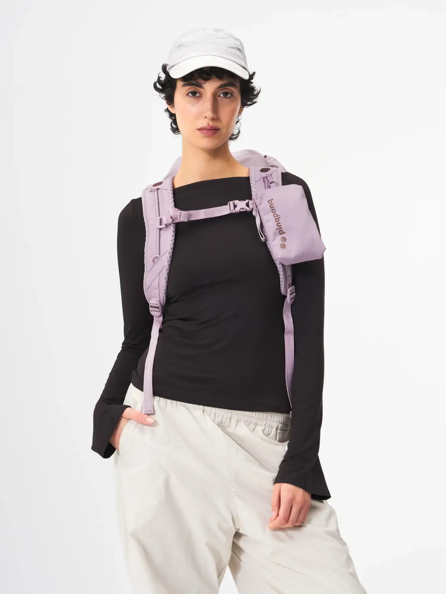 Blok Medium Construct Lilac Backpack worn by a model, showcasing its adjustable straps and stylish design.