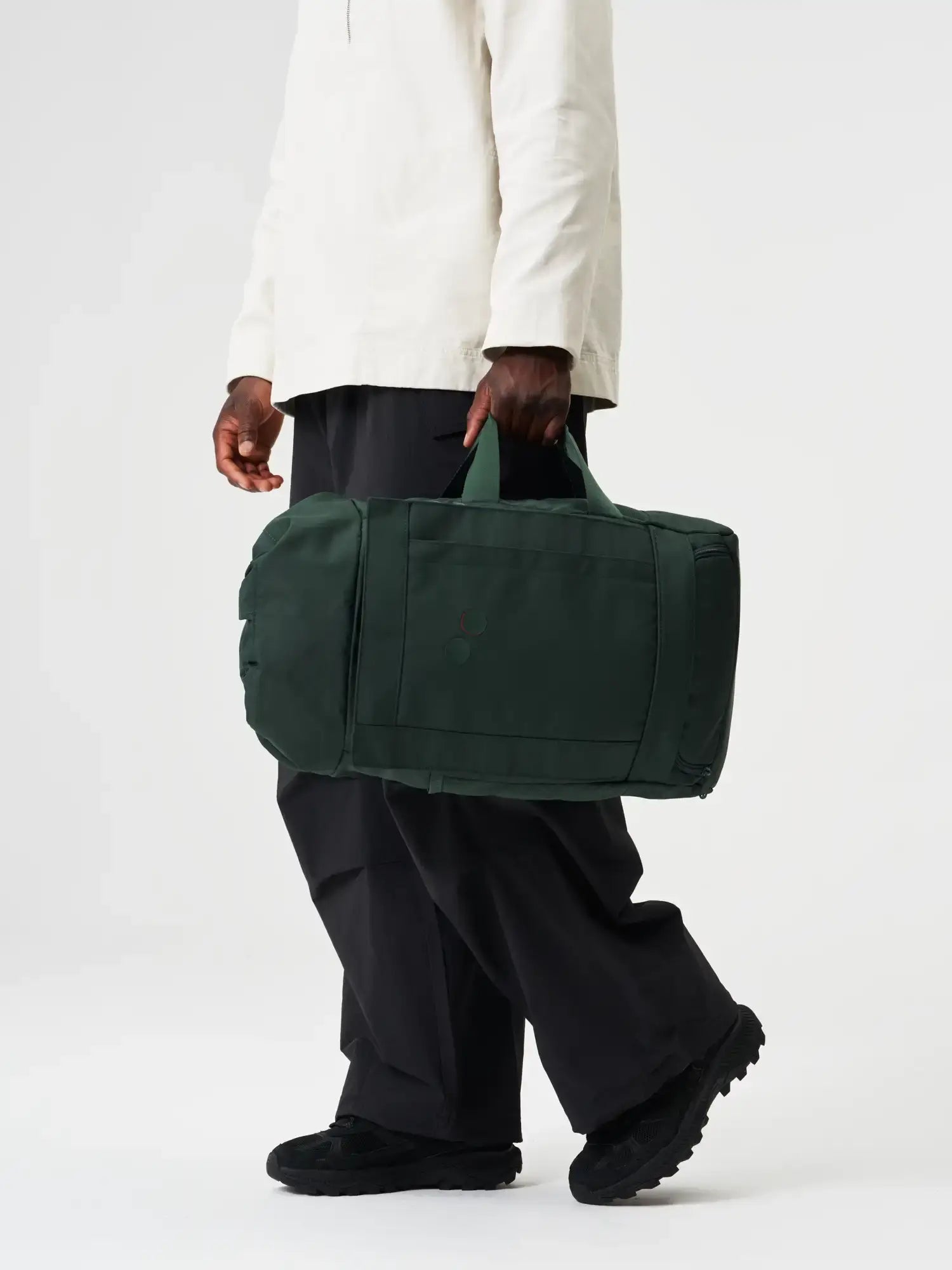 Blok Medium Cosmo Green Backpack being carried by a person in casual wear.