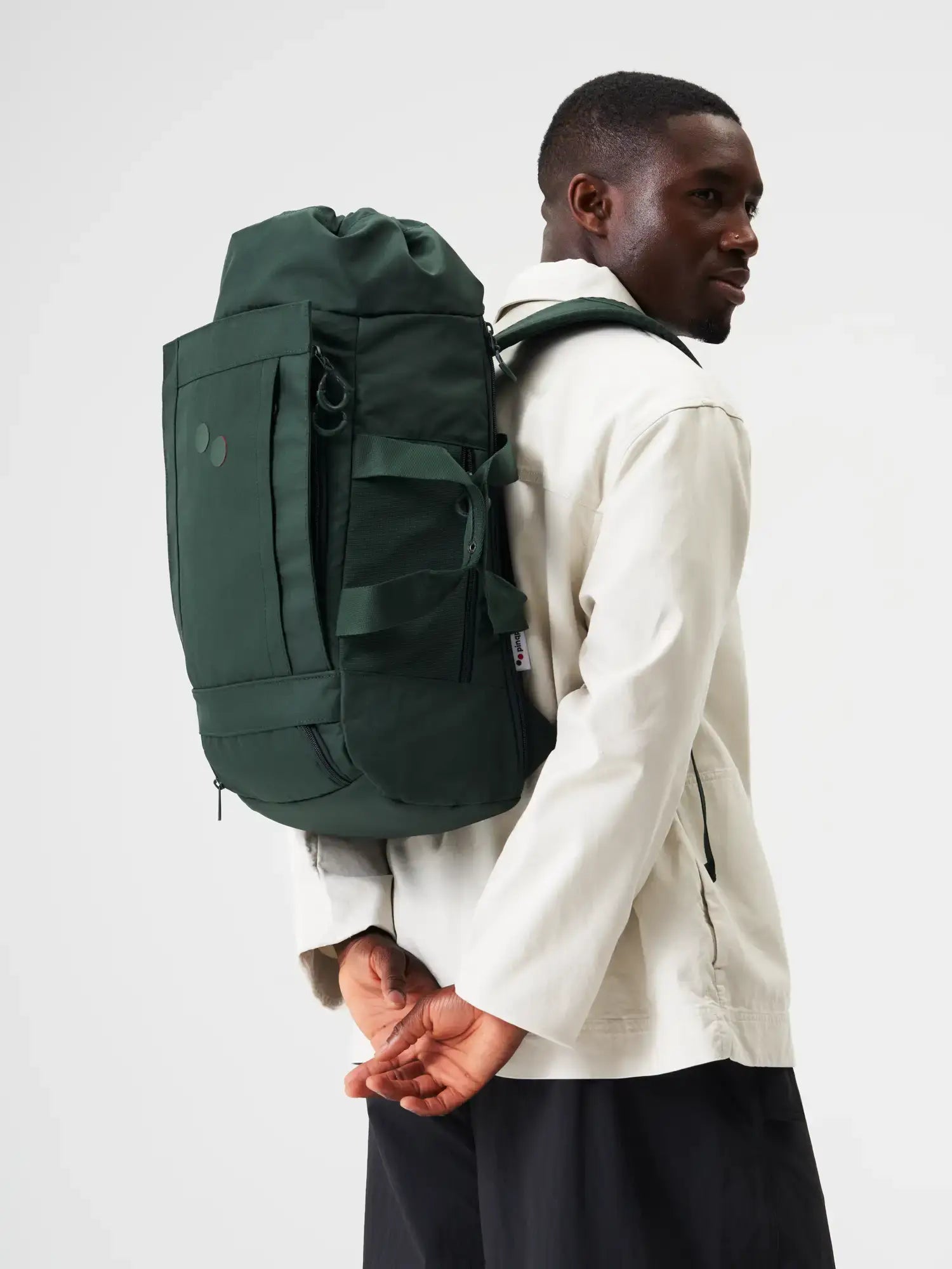 Blok Medium Cosmo Green Backpack worn by a person, featuring adjustable straps and a durable design.