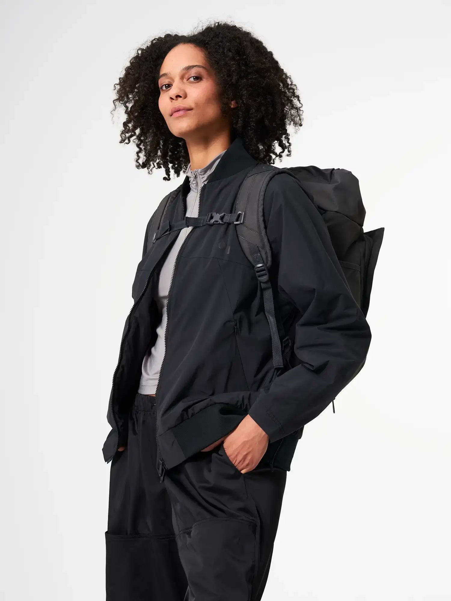 Blok Medium Deep Anthra Backpack worn by a model for outdoor style and functionality.